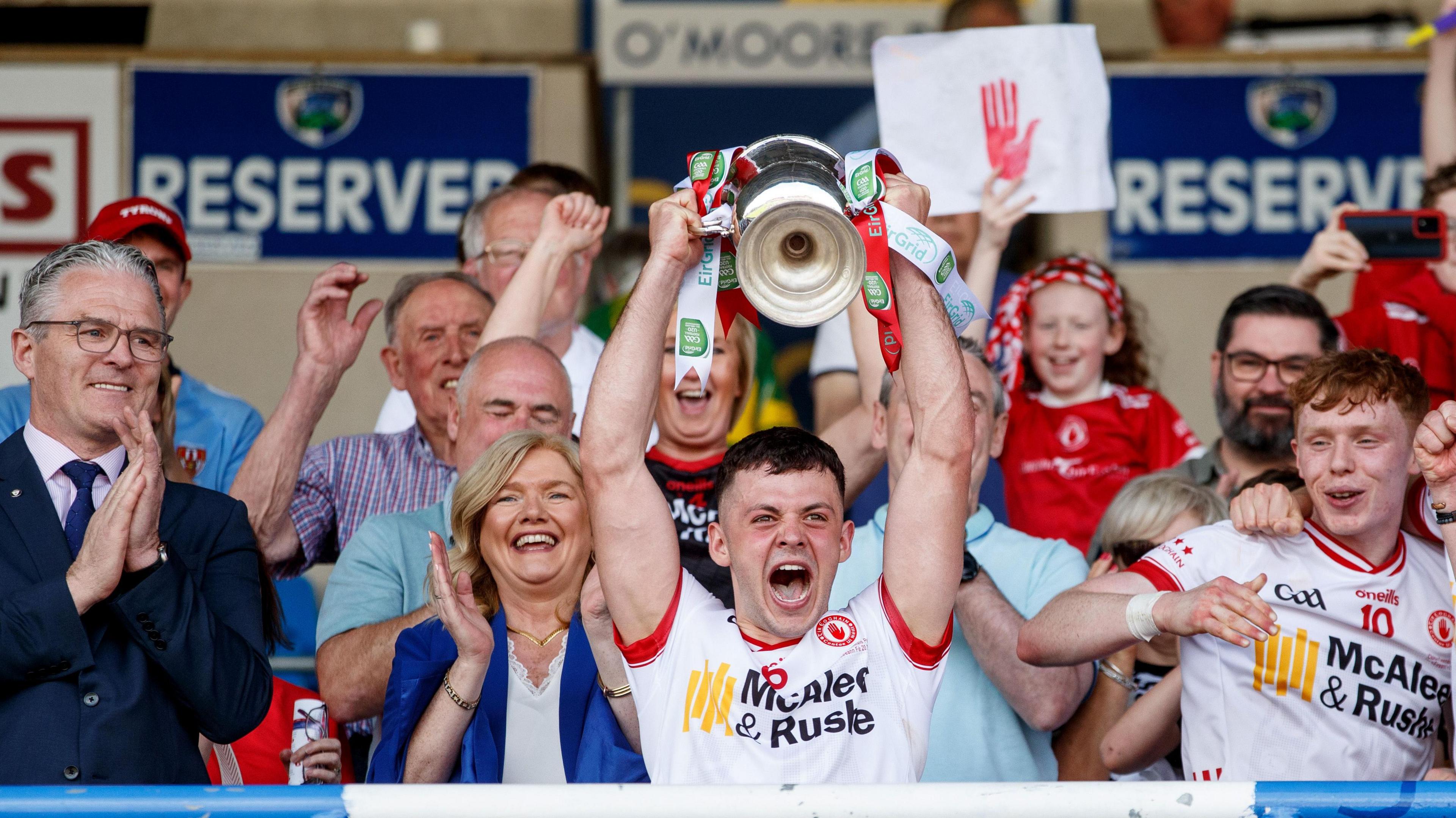 Michael Rafferty lifts the trophy