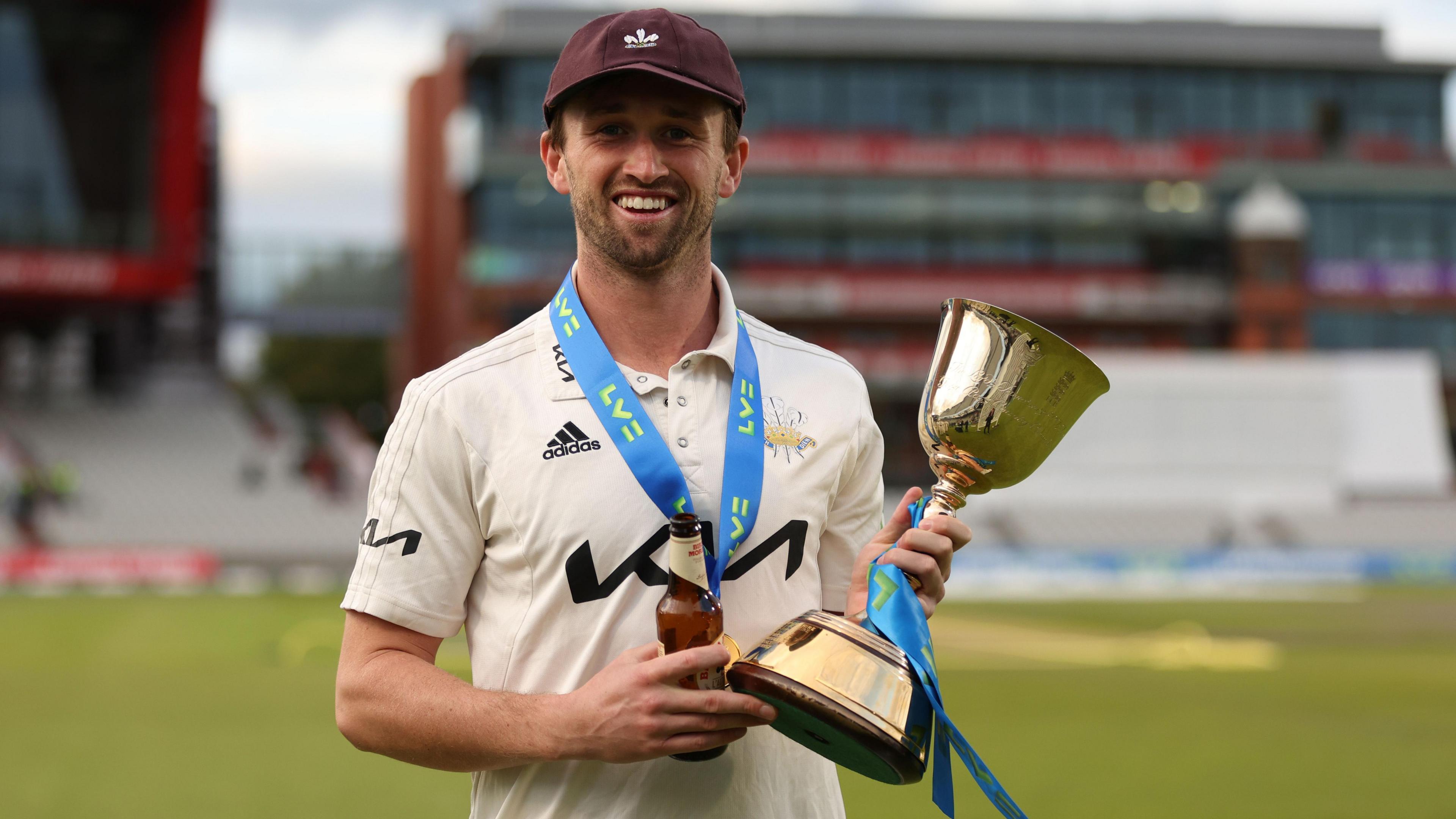 Cameron Steel holds the County Championship trophy