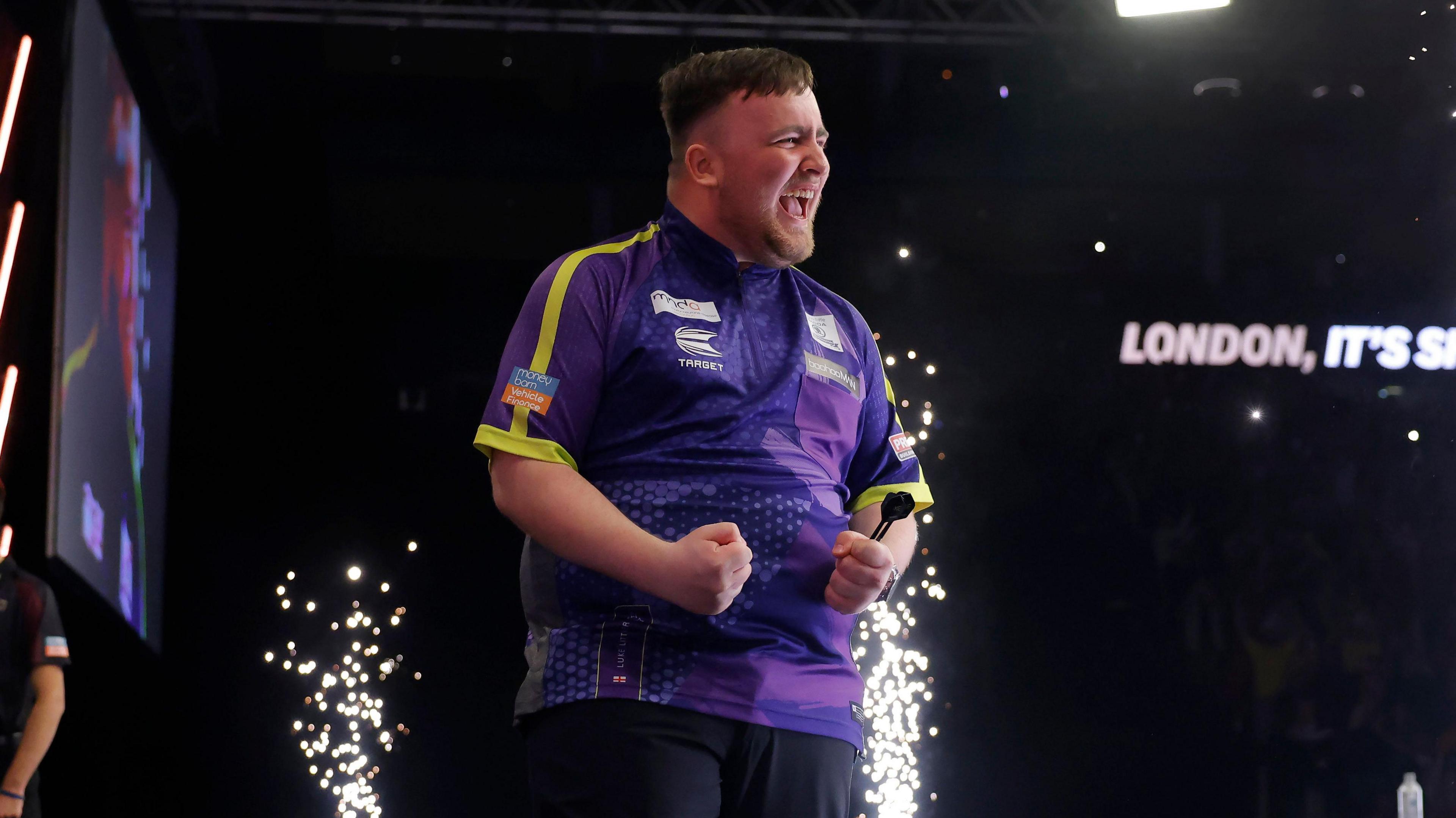 Luke Littler celebrates beating Luke Humphries to win the 2024 Premier League Darts