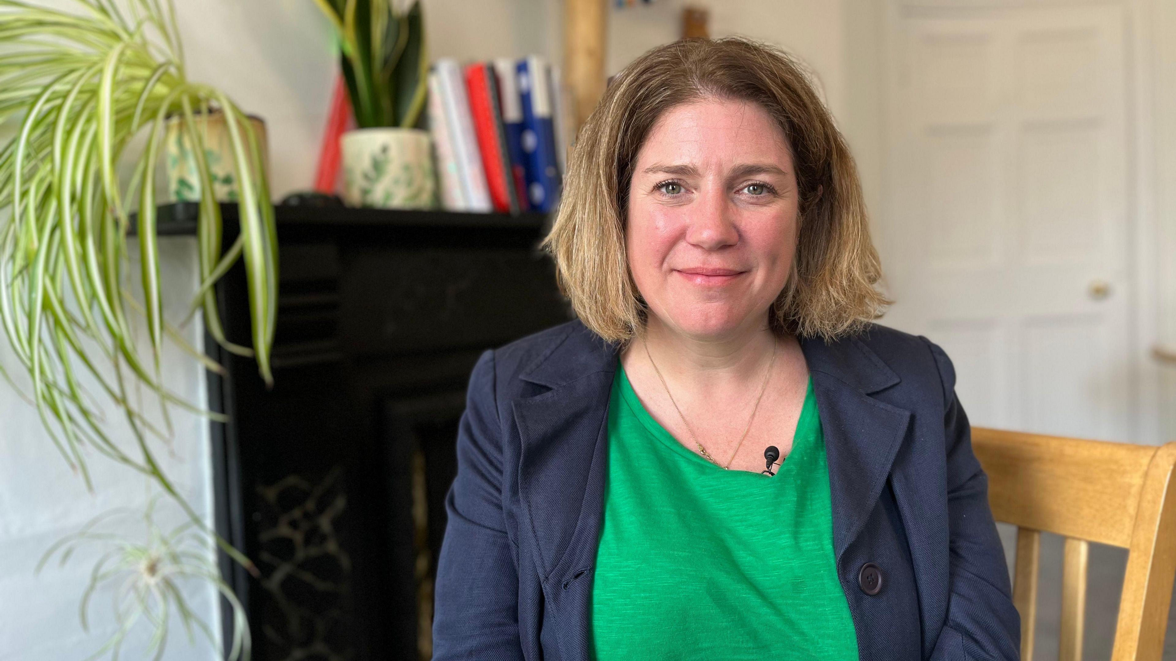 Nicola Lathey sitting down in her office at the Owl Centre in Cheltenham