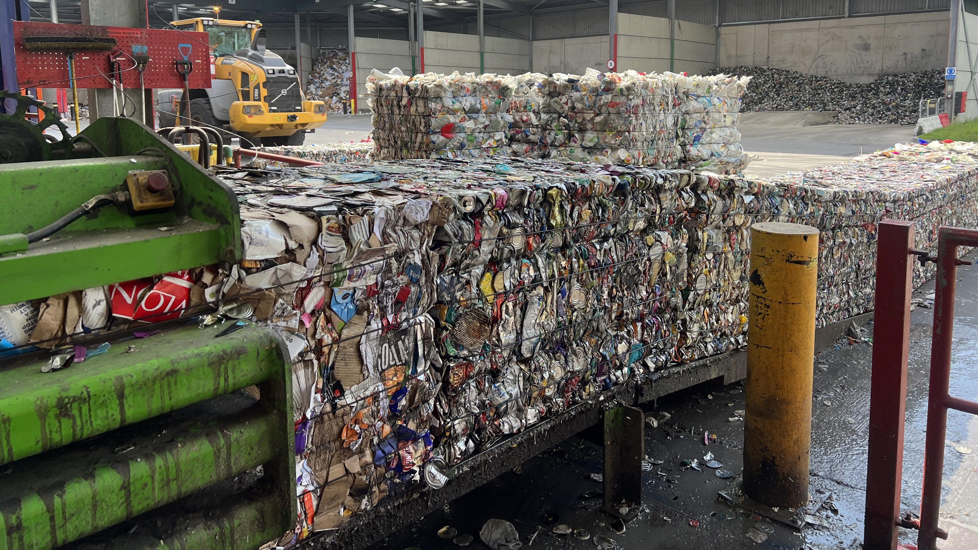 A row of compacted waste a recycling plant