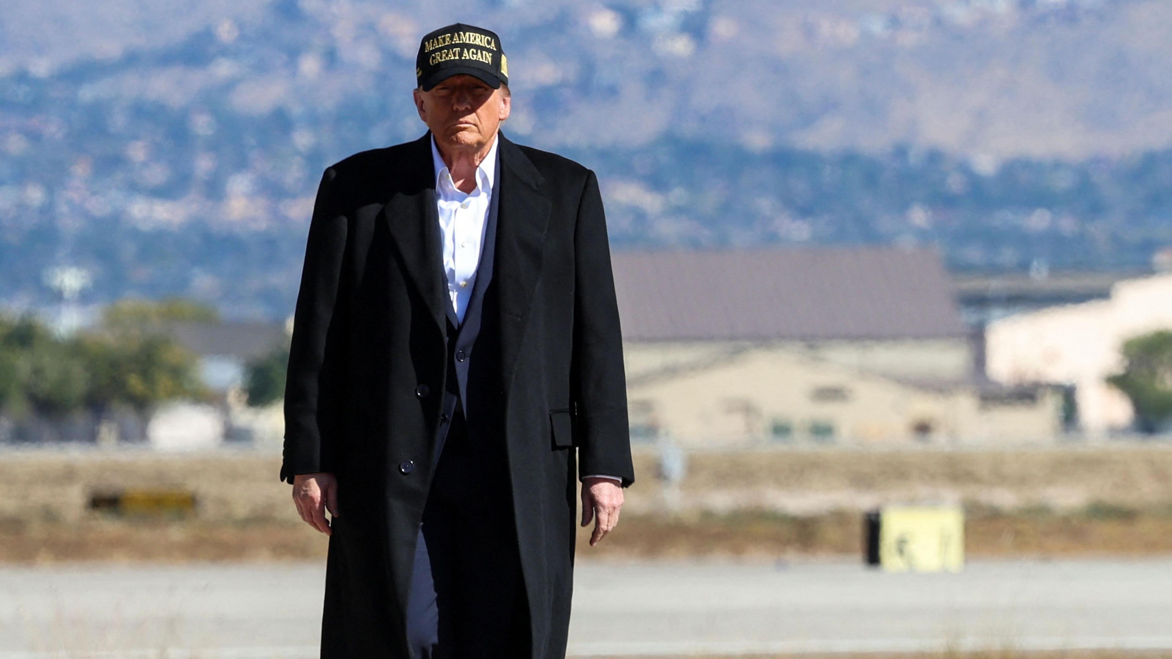 Republican presidential nominee and former U.S. President Donald Trump walks as he arrives at Albuquerque International Sunport, in Albuquerque, New Mexico