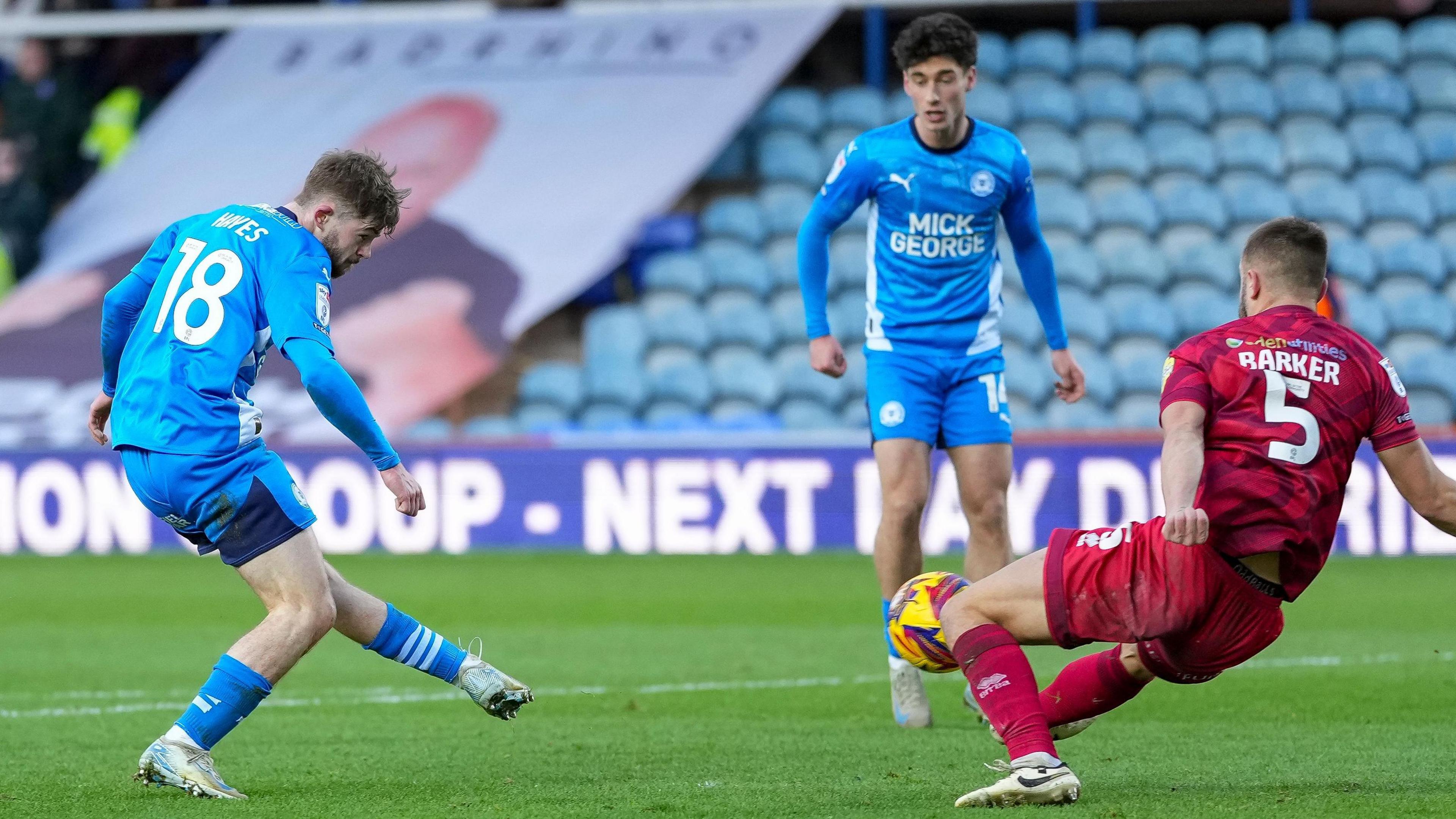 Peterborough's Cian Hayes sidefoots into the net against Crawley Town