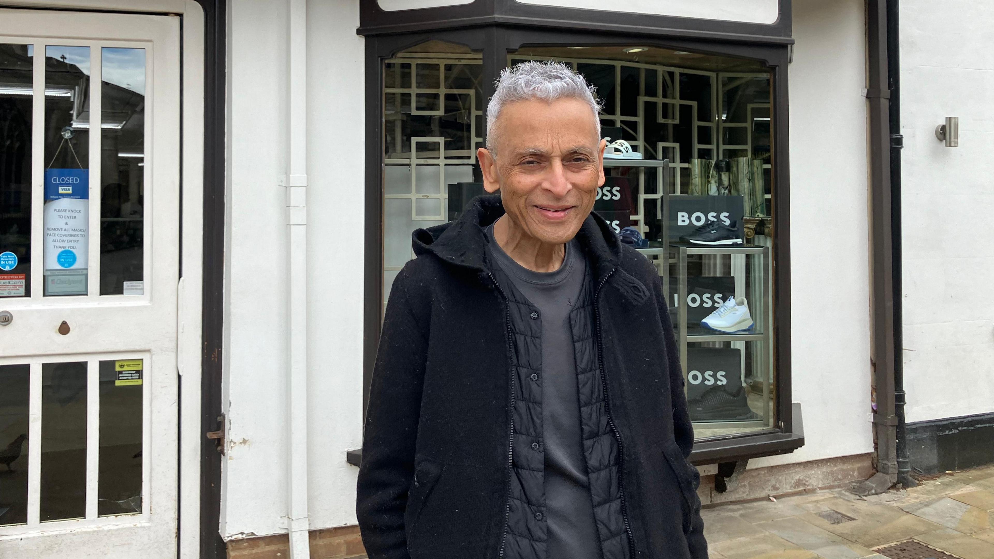 Paul Morarji outside his clothing shop in Peterborough