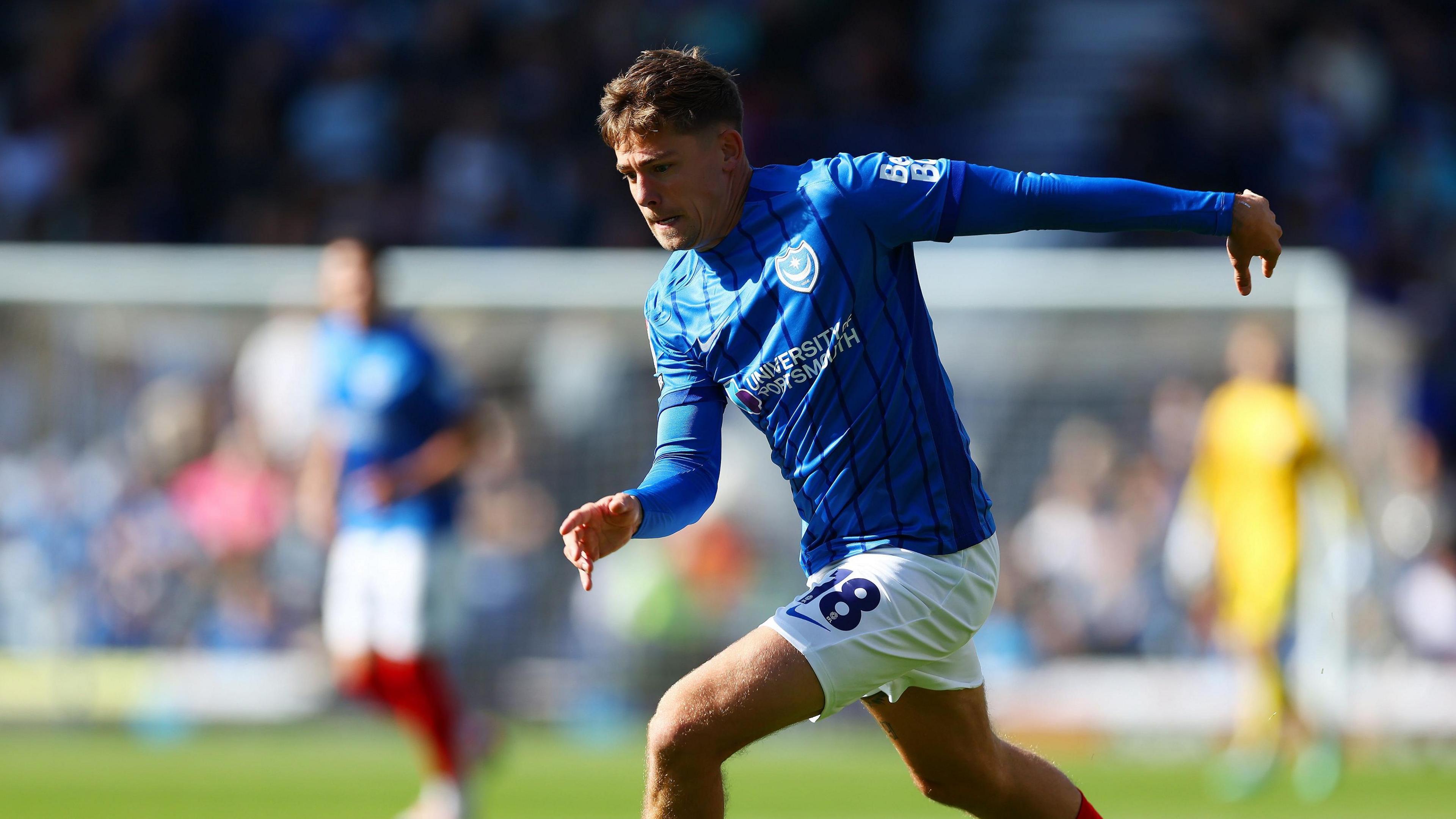 Elias Sorensen playing for Portsmouth in their game against Oxford United