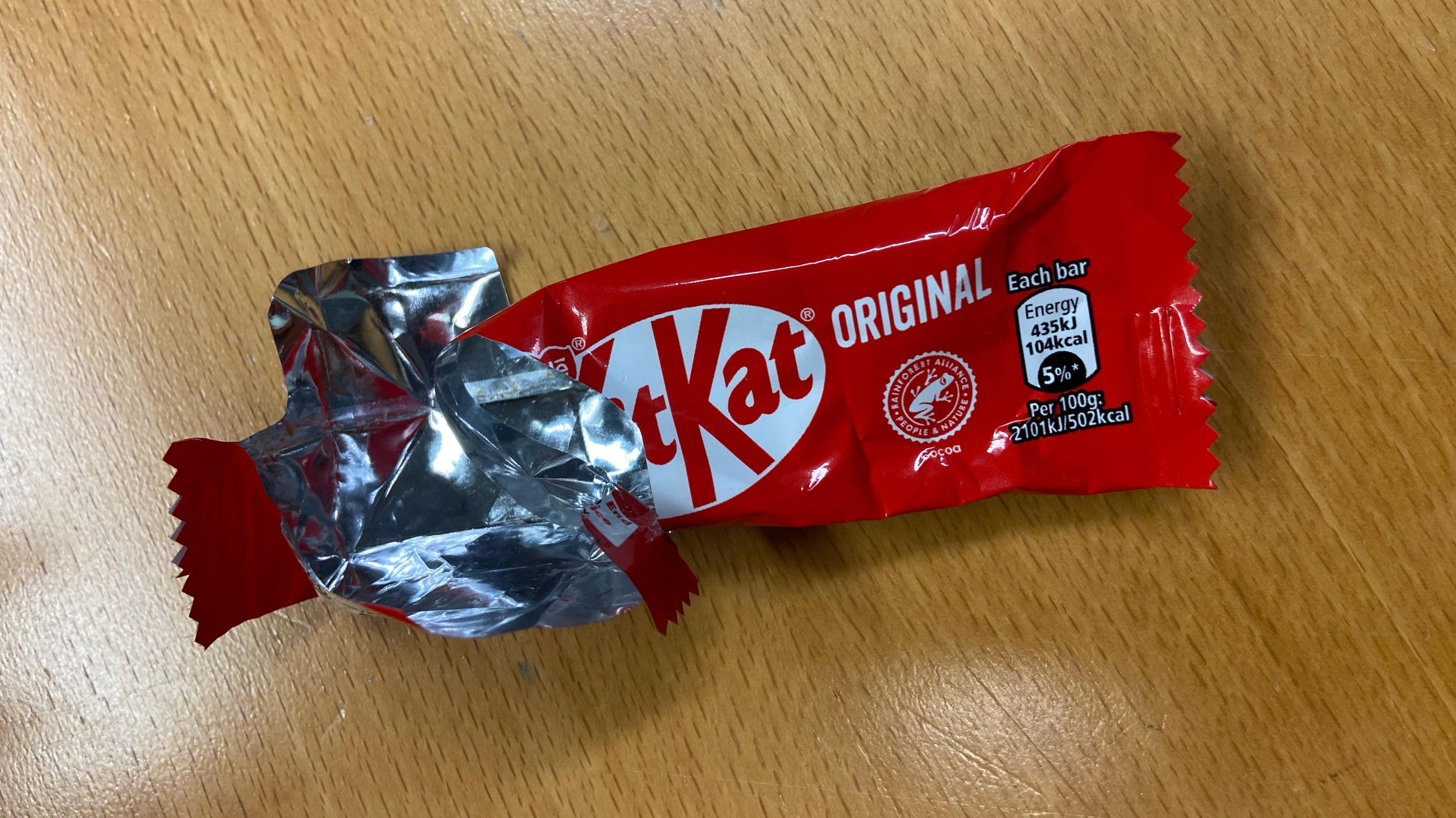 A KitKat wrapper is pictured on a table