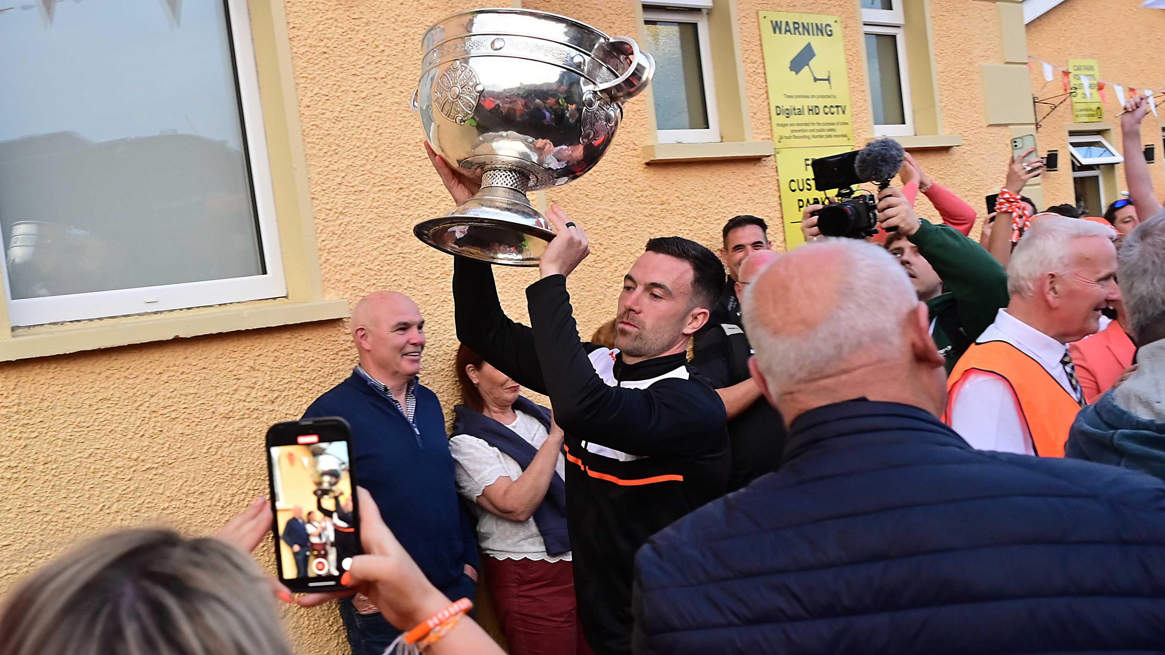 The team holding the Sam Maguire cup