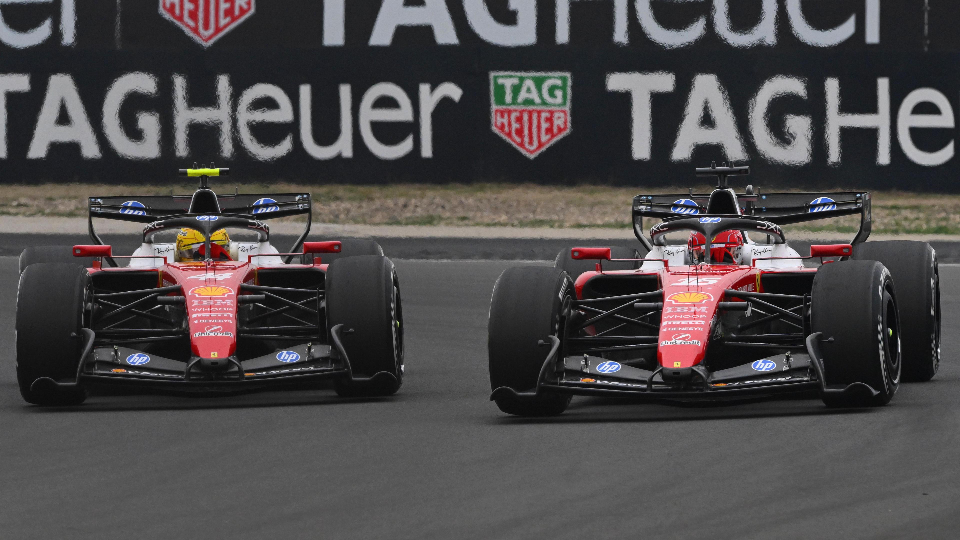 The Ferraris of Lewis Hamilton (left) and Charles Leclerc side by side through a corner during the Chinese Grand Prix