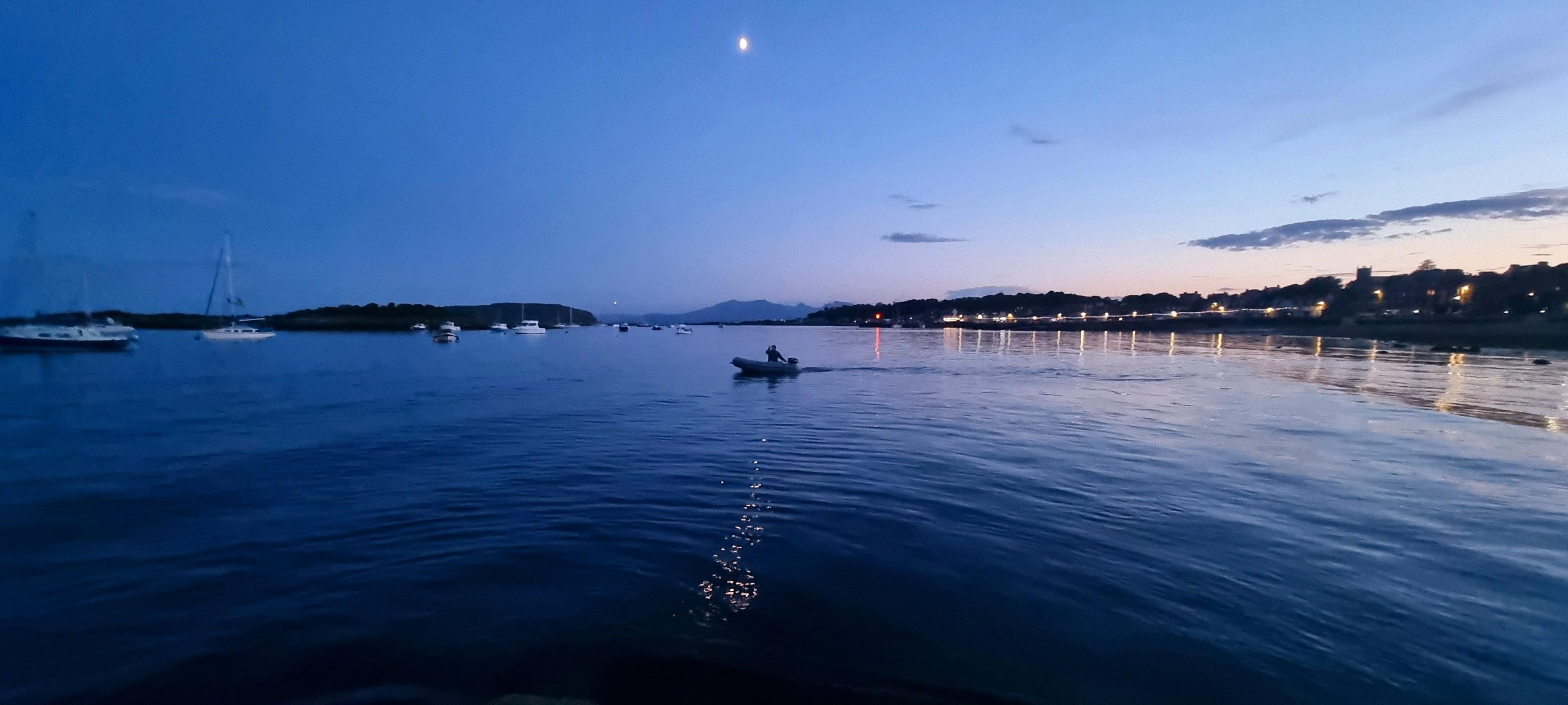 Lone boater at sunset