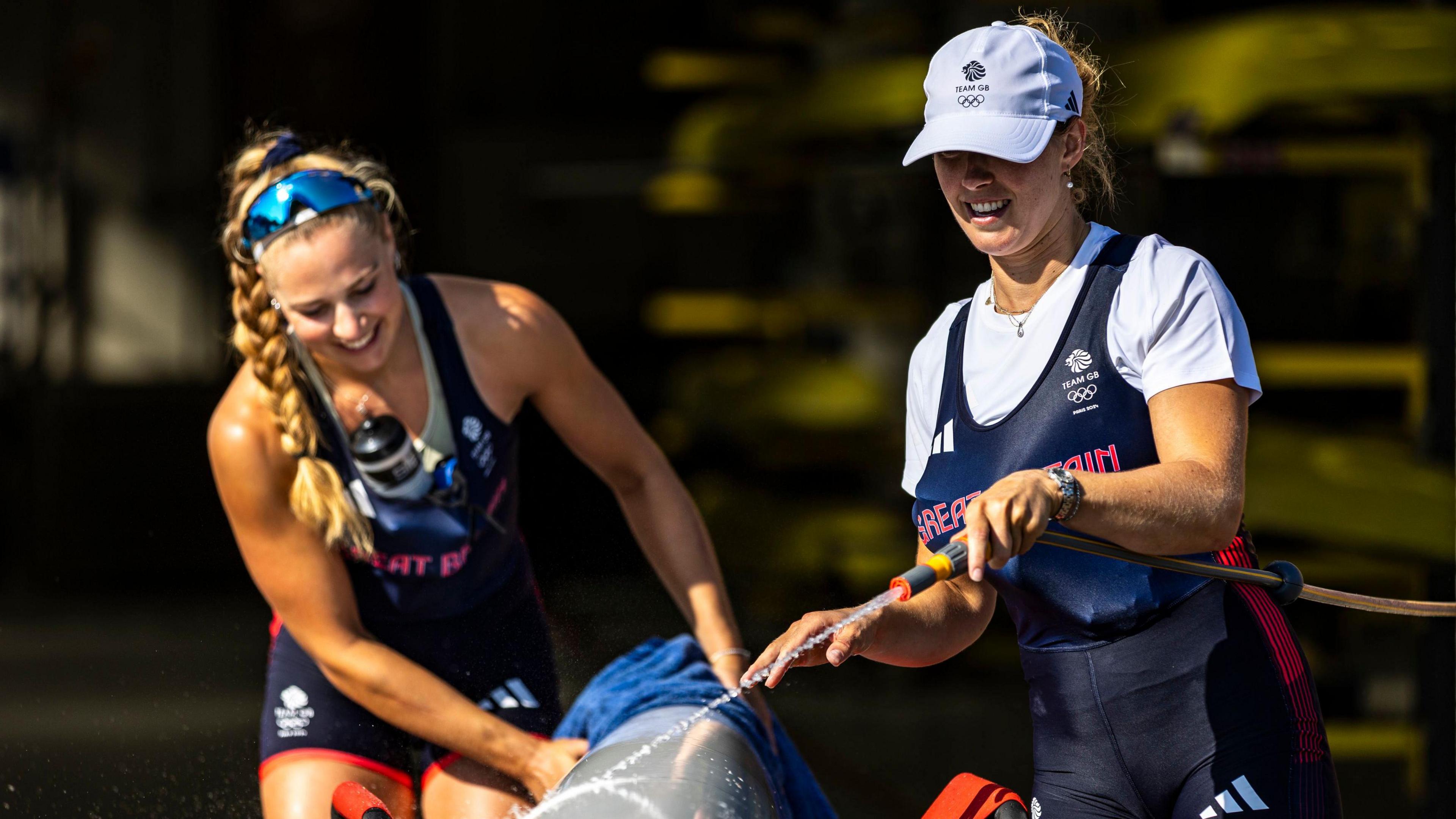 Great Britain’s Mathilda Hodgkins Byrne (R) and Becky Wilde washing down their boat during a training session at the Redgrave Pinsent Rowing Lake, Reading