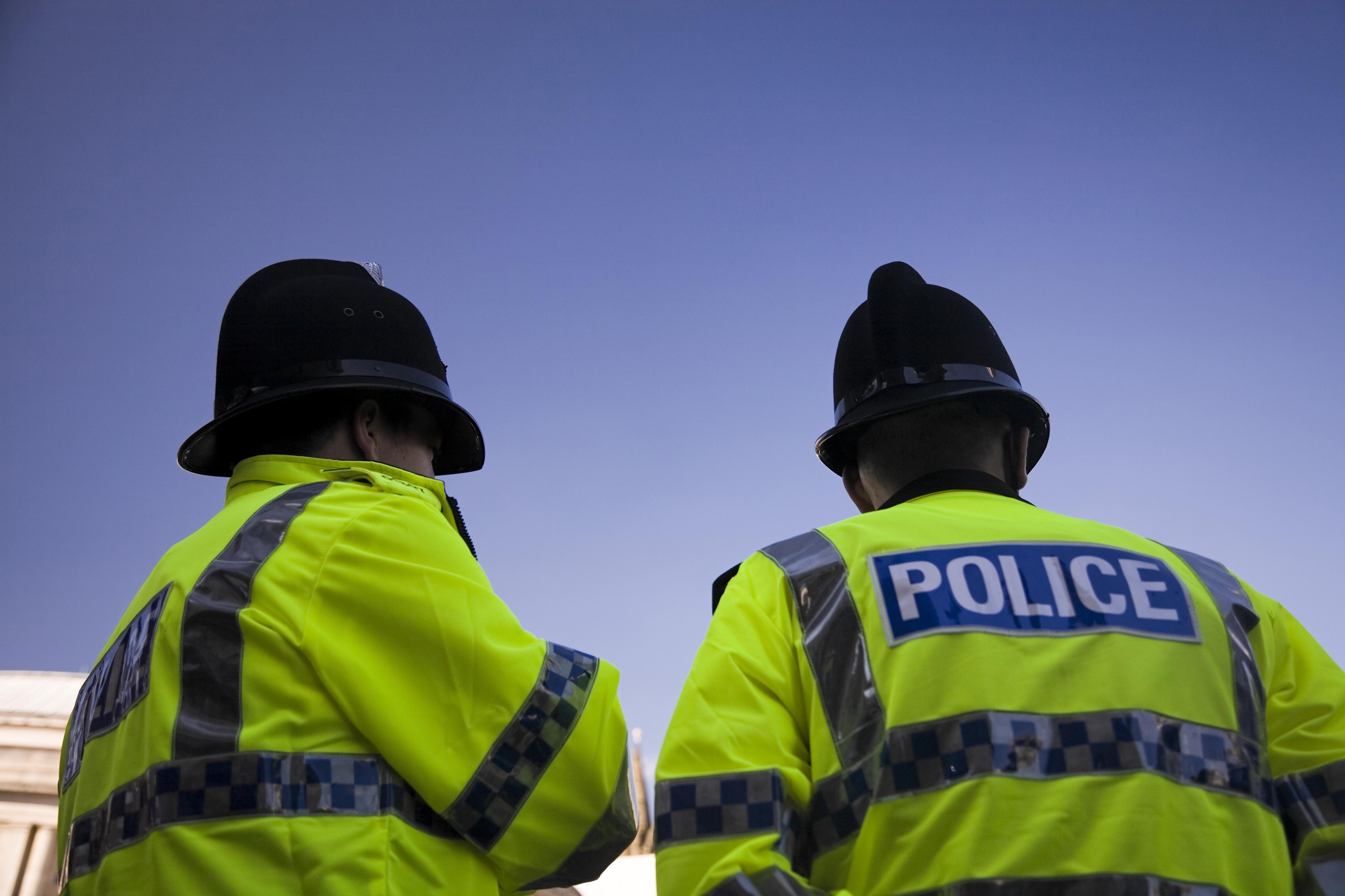 Two police officers wearing high vis jackets