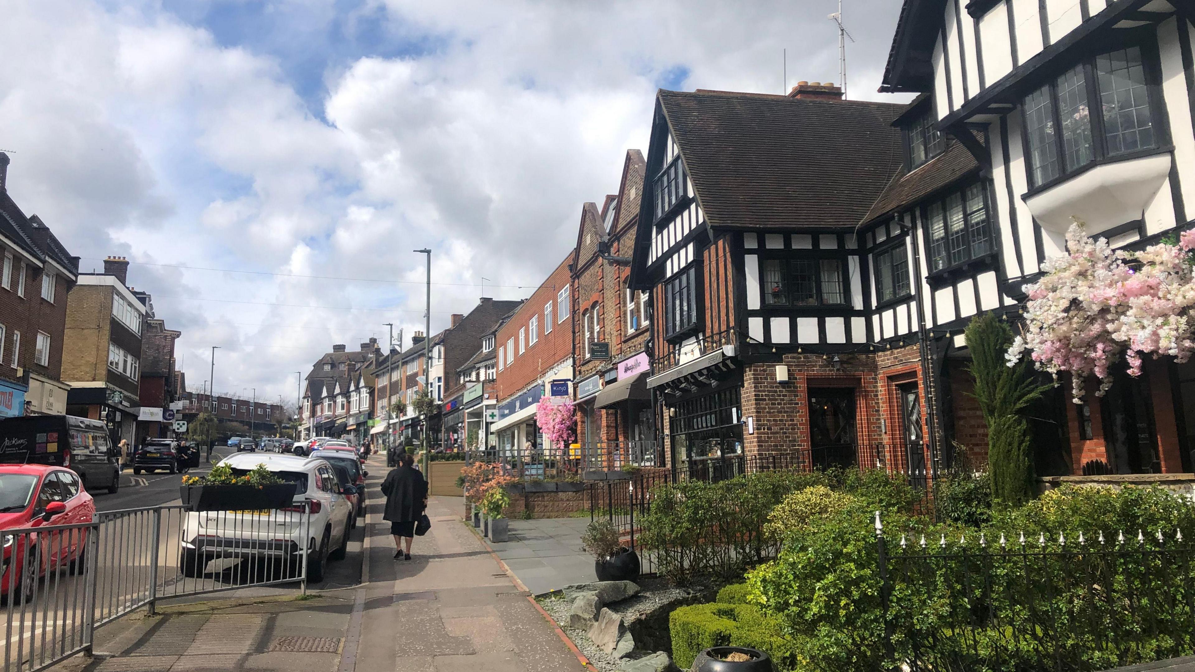 Town of Oxted, high street, cars, shops