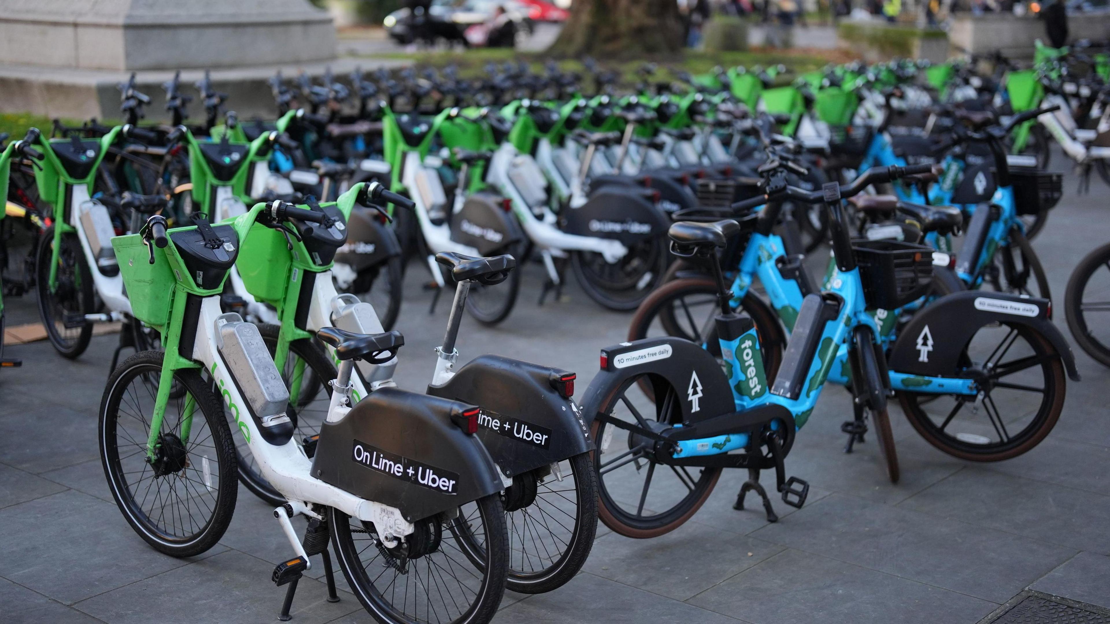 Lot of bikes are parked in lines 