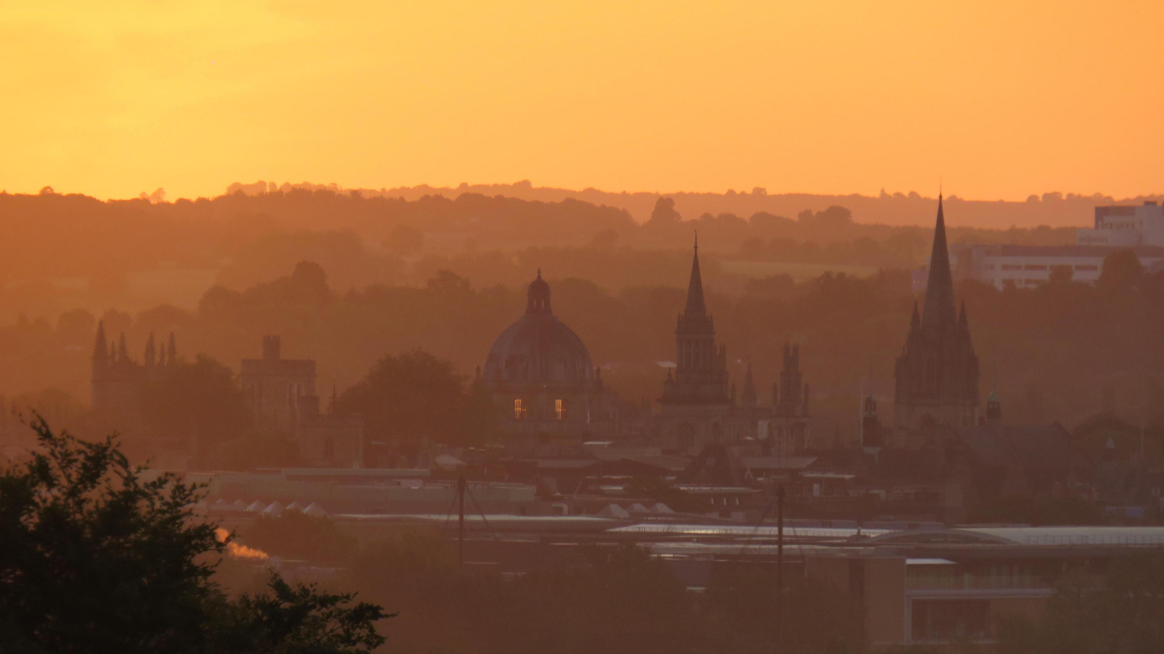 MONDAY - The sky glows orange over North Hinksey