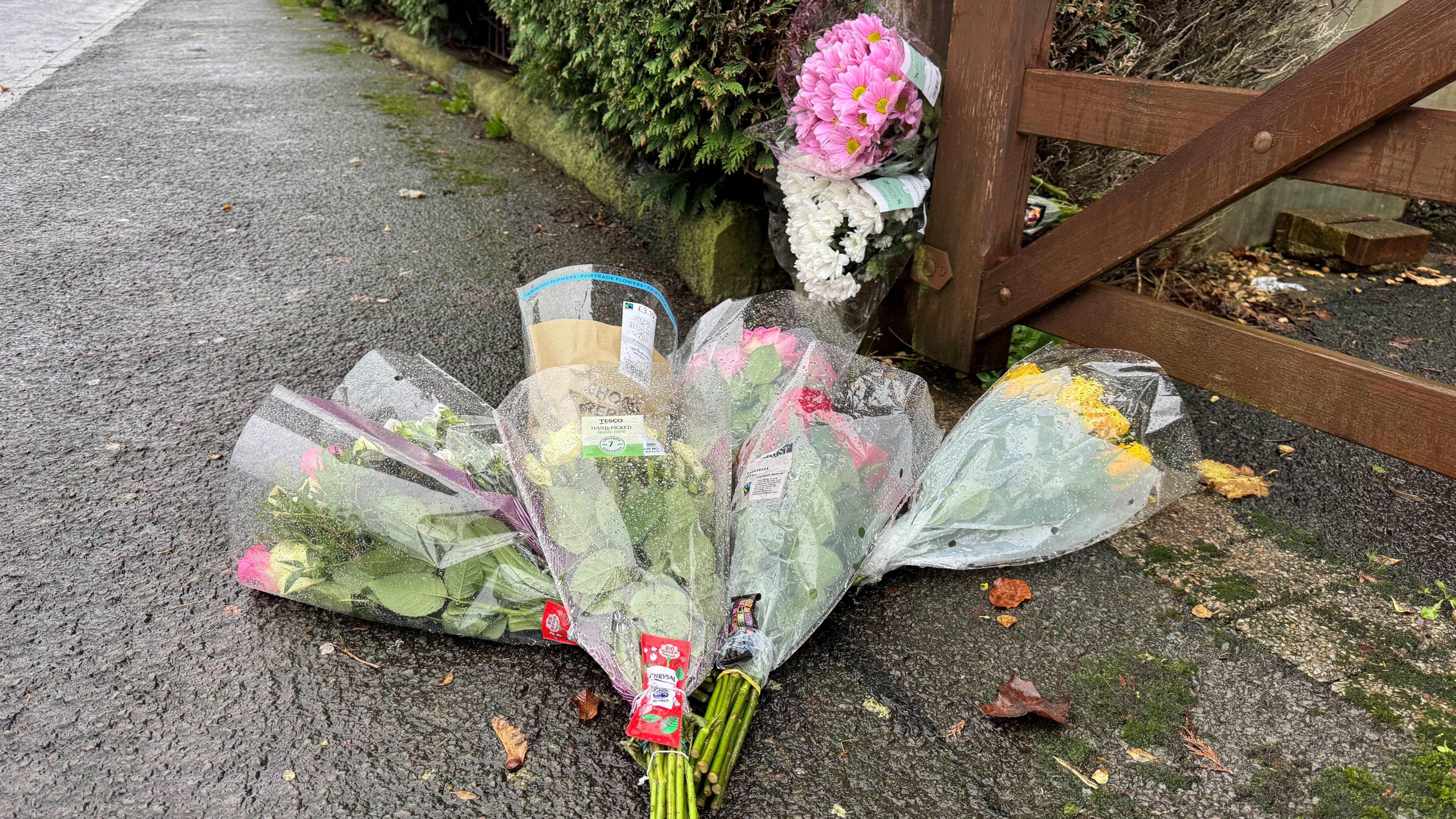 multiple bouquets of flowers on the ground 