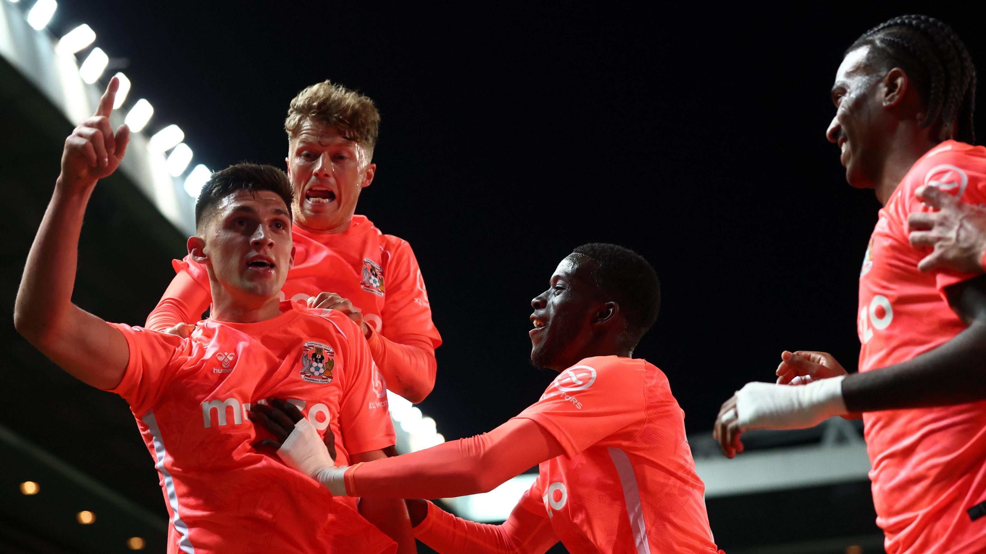 Bobby Thomas celebrates with his team-mates after heading home the equaliser to secure Coventry City's promotion back to the Premier League after 25 years.