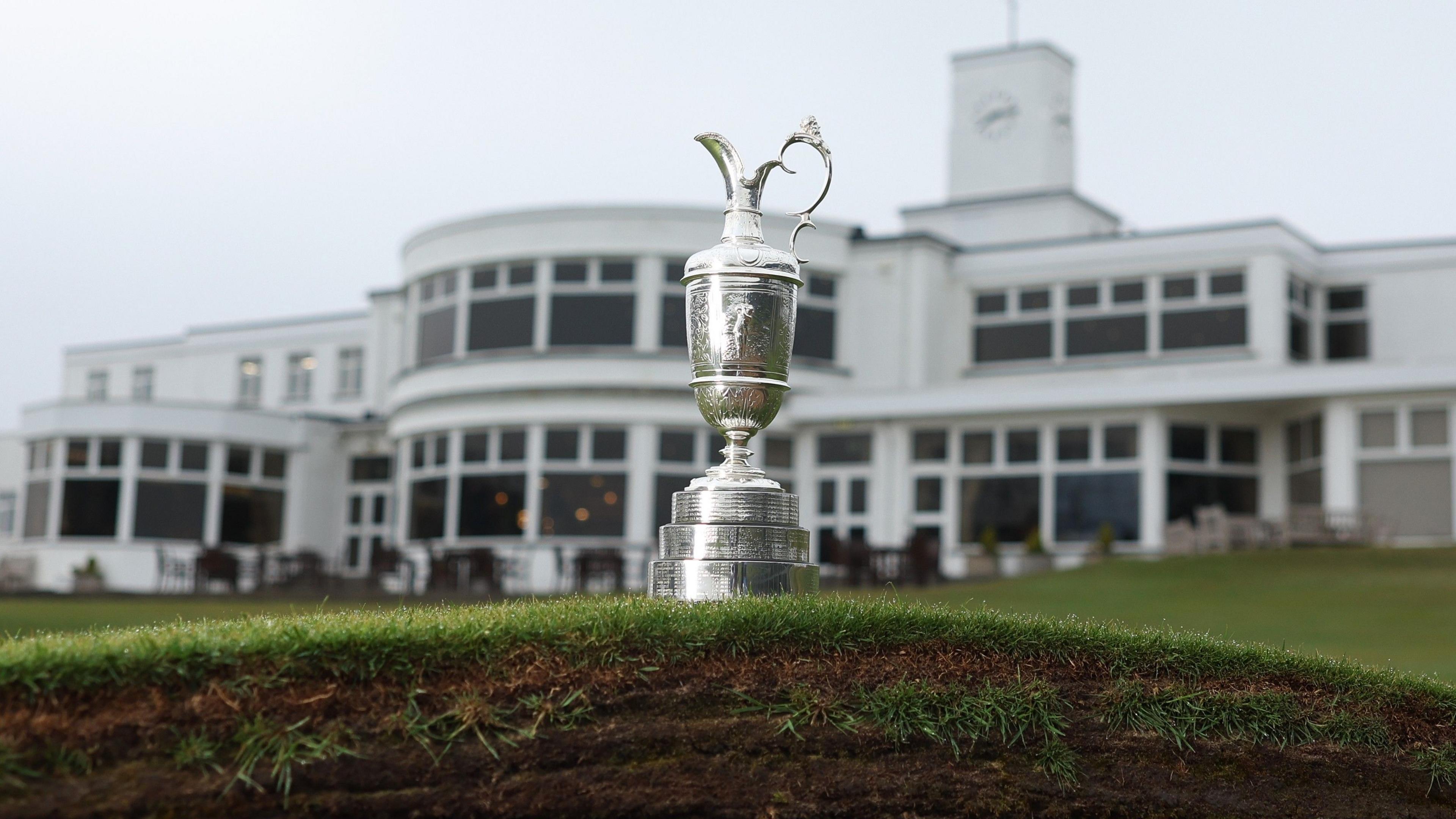 The Claret Jug photographed on top of a bunker in front of the Royal Birkdale clubhouse