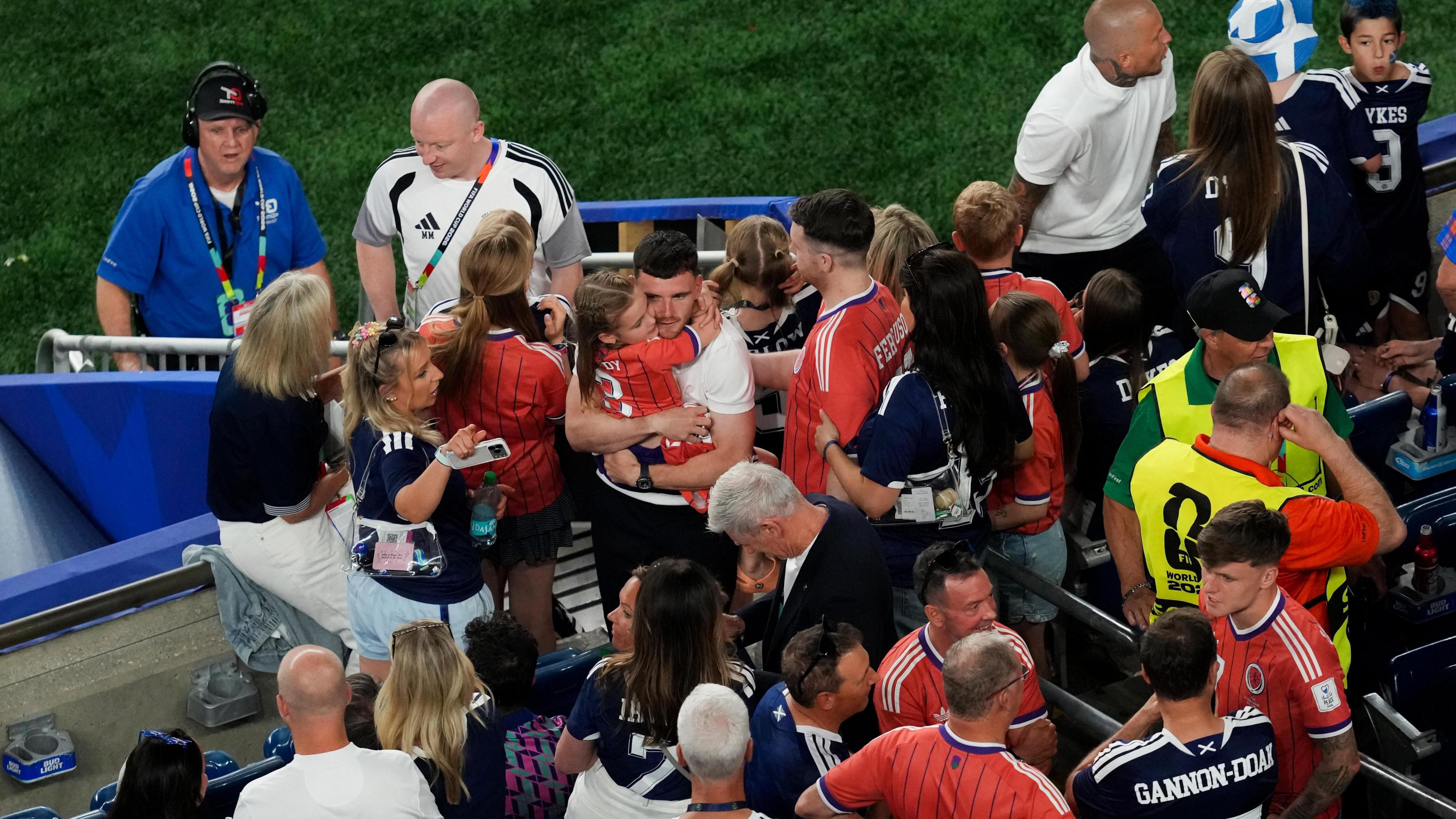 Captain Andy Roberton with his friends and family after the full-time whistle 