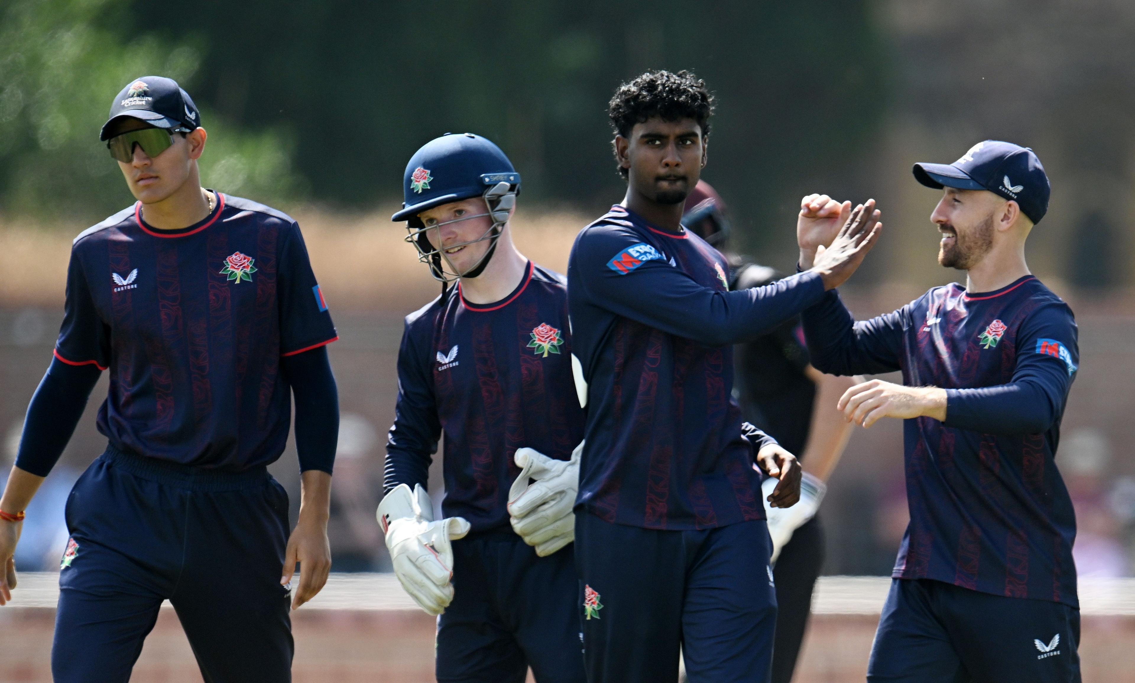Arav Shetty is congratulated by Josh Bohannon (far right) while wicketkeeper George Bell is just behind Shetty