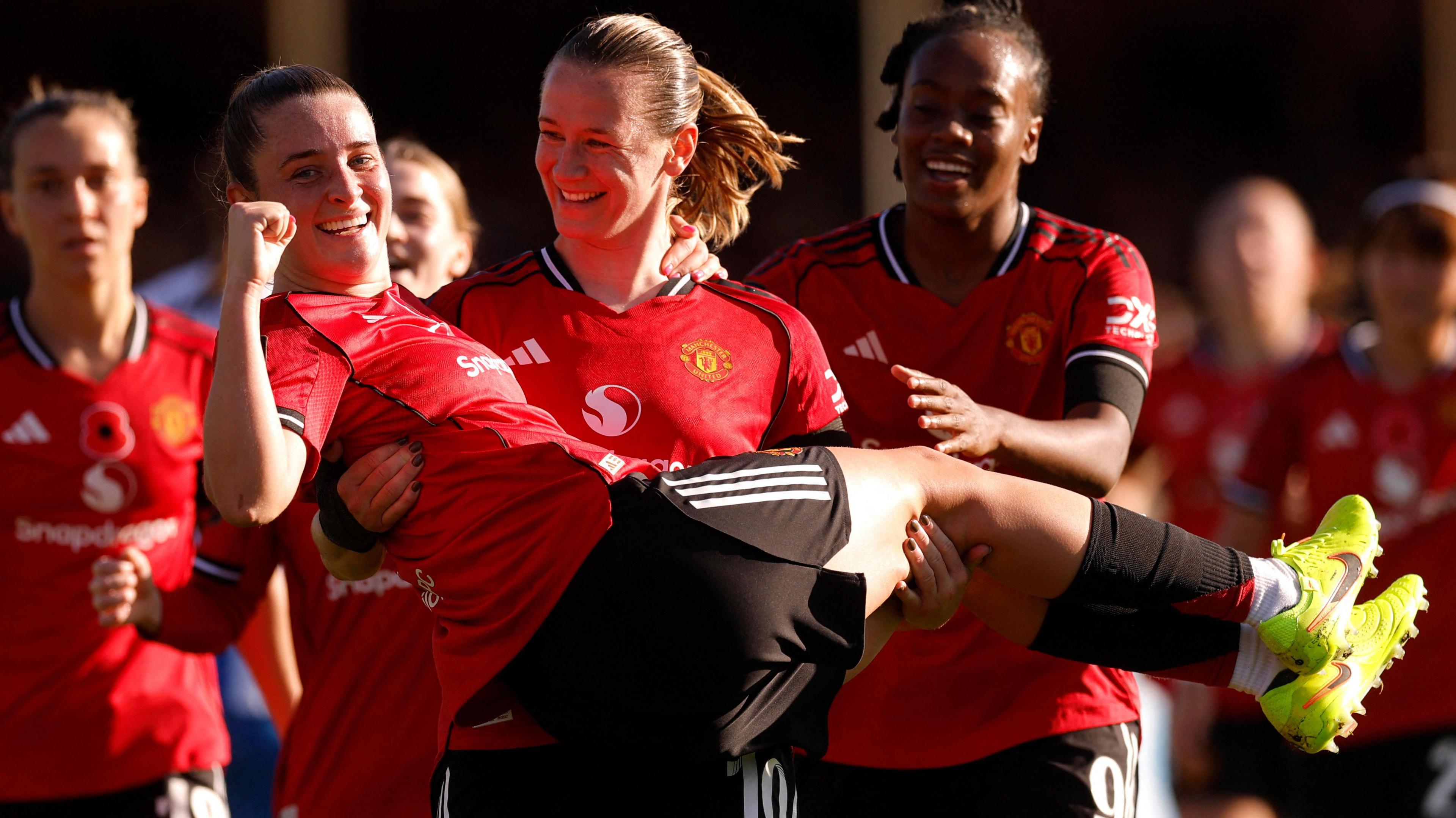 Manchester United's Elisabeth Terland celebrates scoring their first goal with Ella Toone