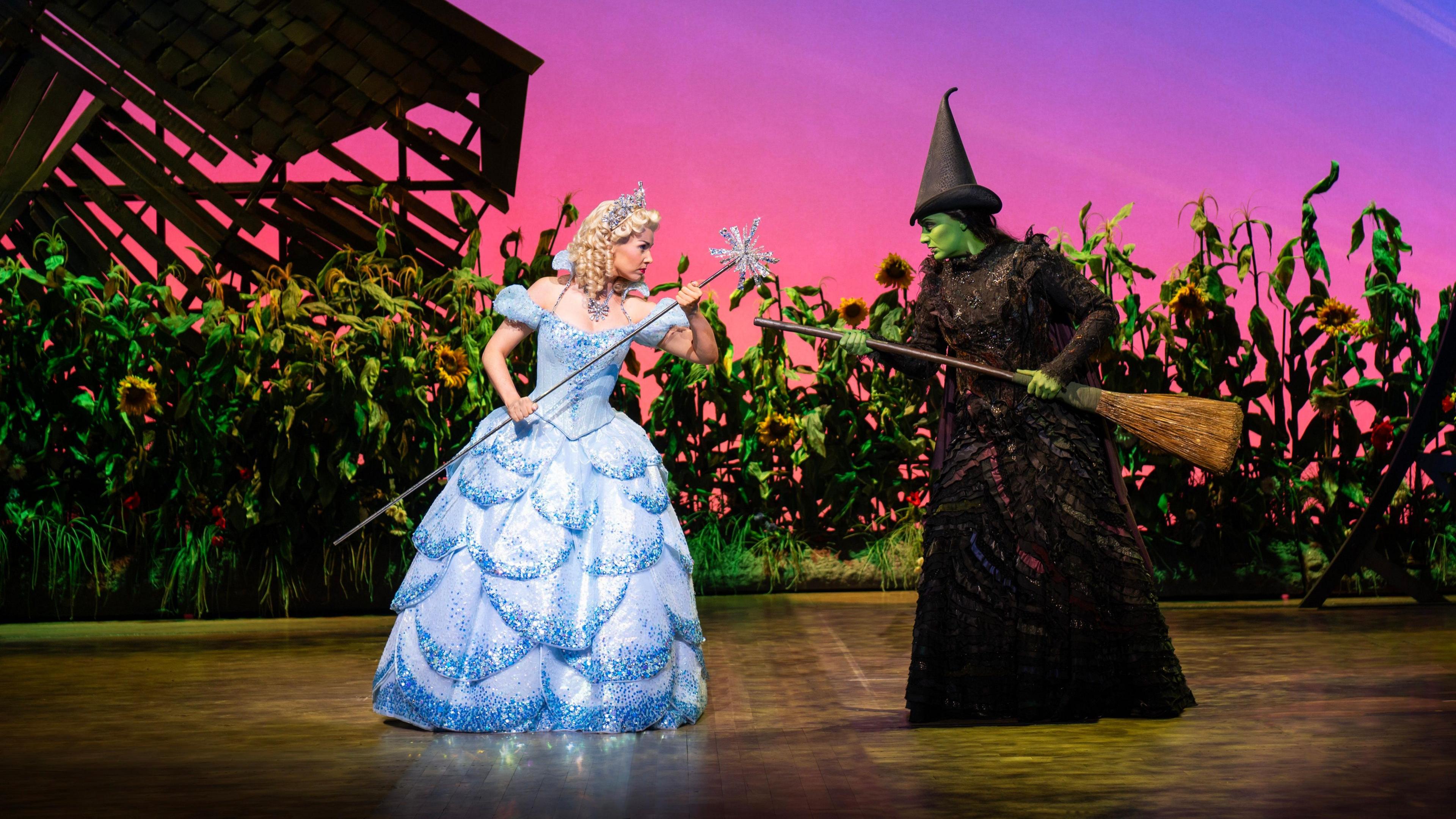 Glinda and Elphaba from the hit musical Wicked face off on stage in the Wales Millennium Centre.