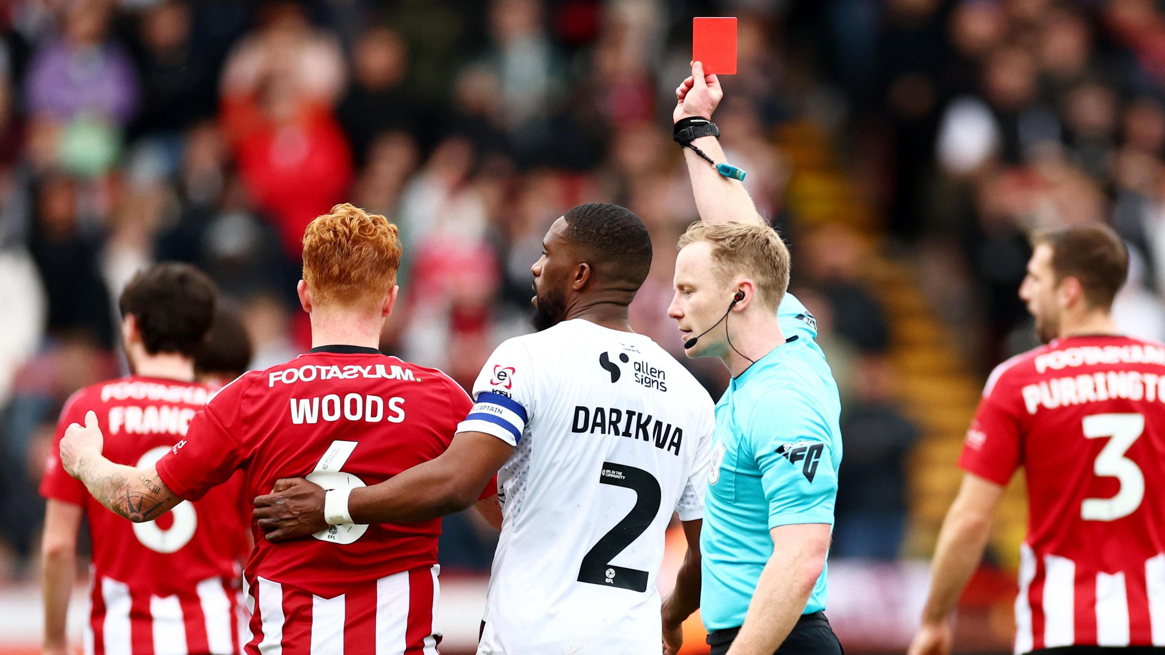 Exeter's Ryan Woods is sent off against Lincoln City