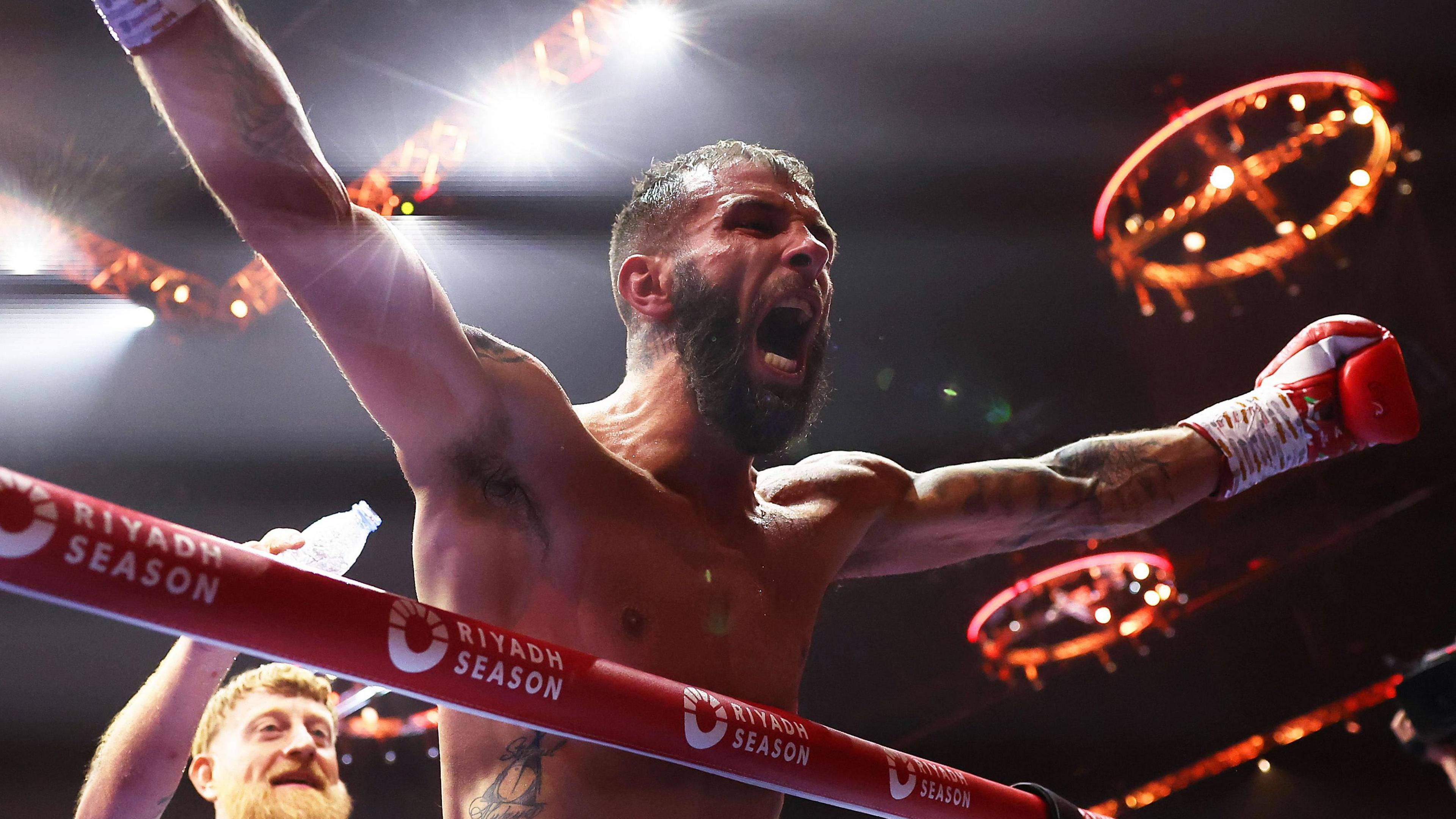 Anthony Cacace celebrates winning the world title