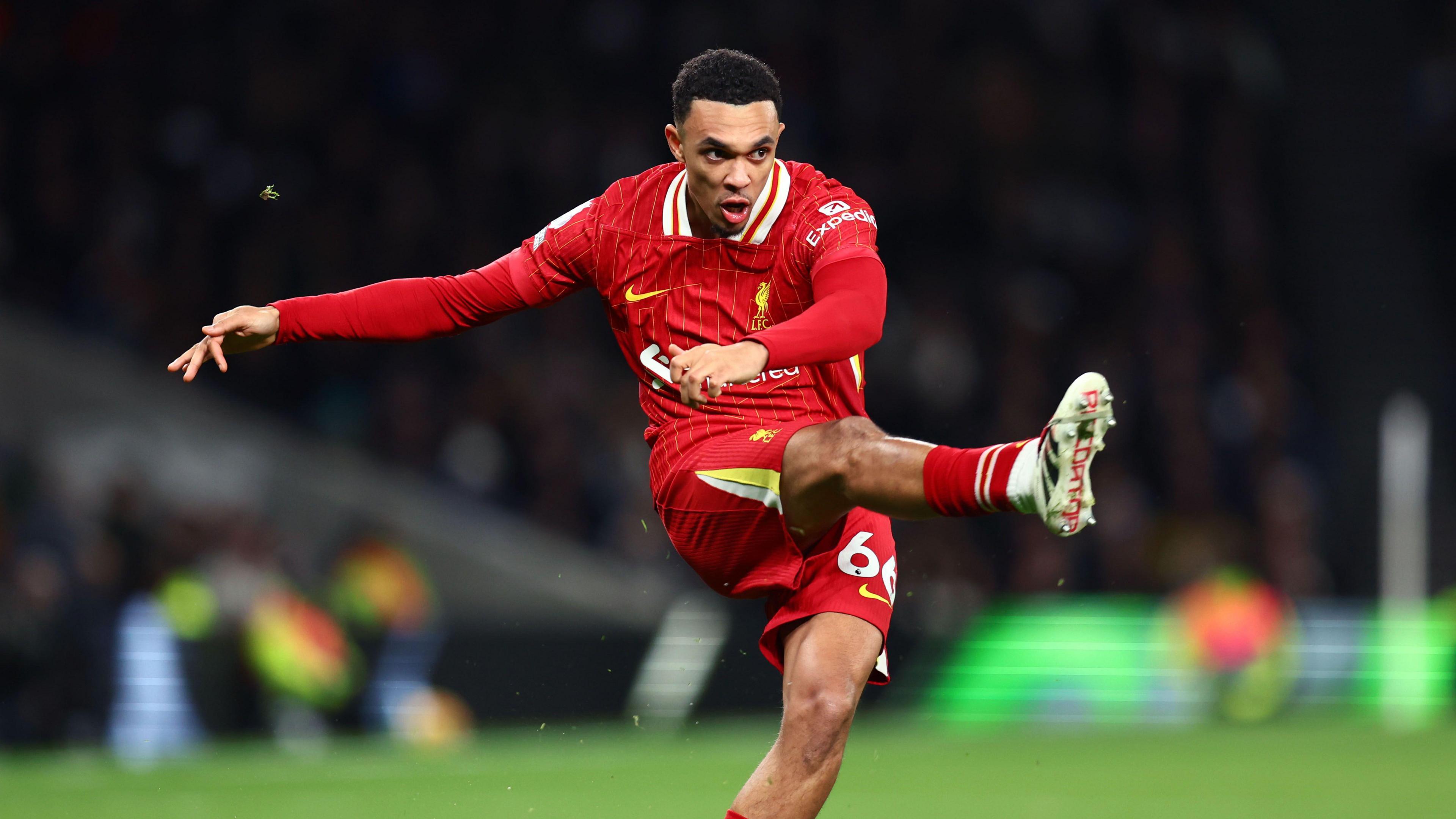 Liverpool's Trent Alexander-Arnold striking a football