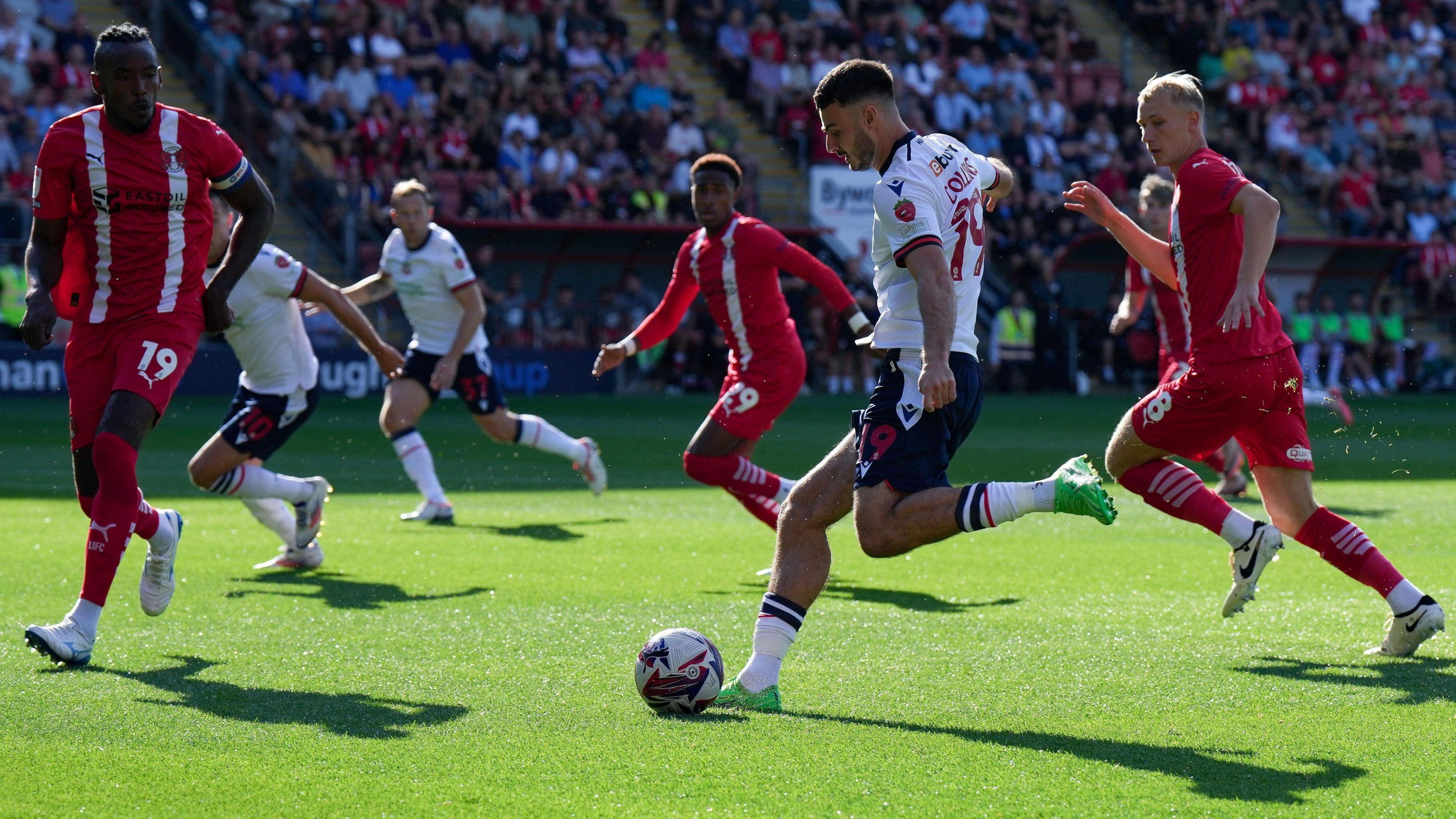 Bolton's Aaron Collins takes a shot against Leyton Orient