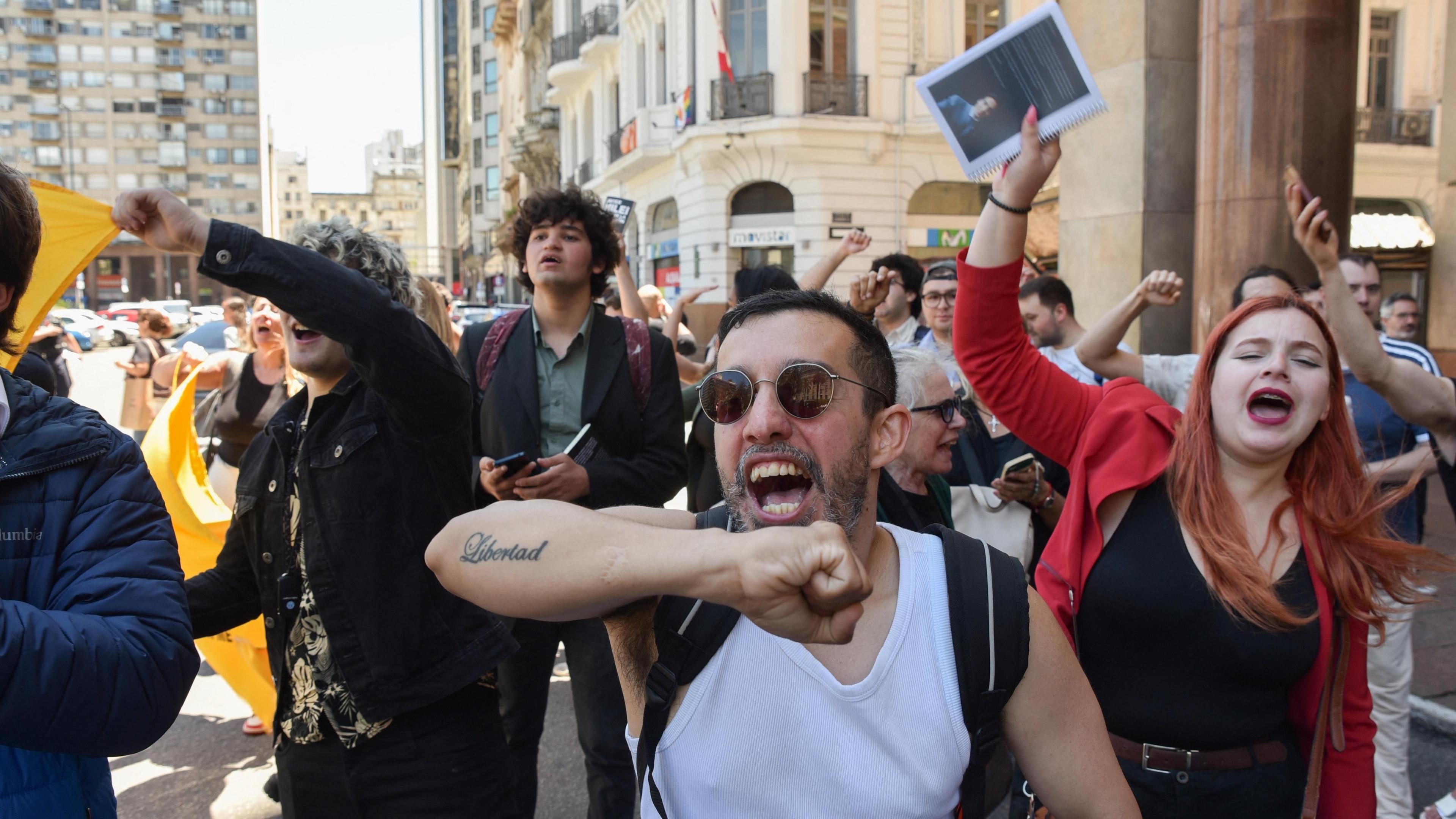 Supporters of Argentina's President Javier Milei shout slogans on the day of the Mercosur summit in Montevideo, Uruguay, 6 December 2024