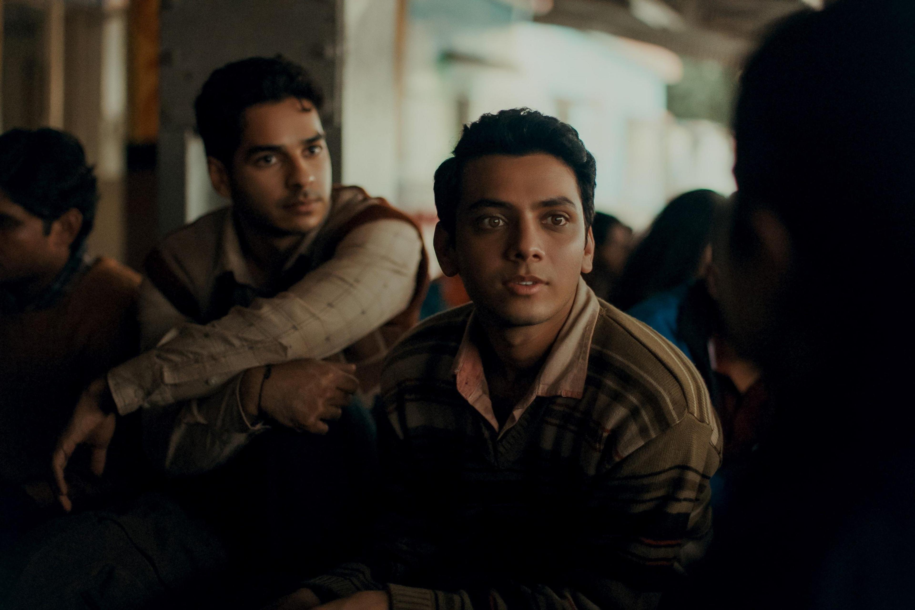 A still from Homebound shows a close up of the two male characters from the film.