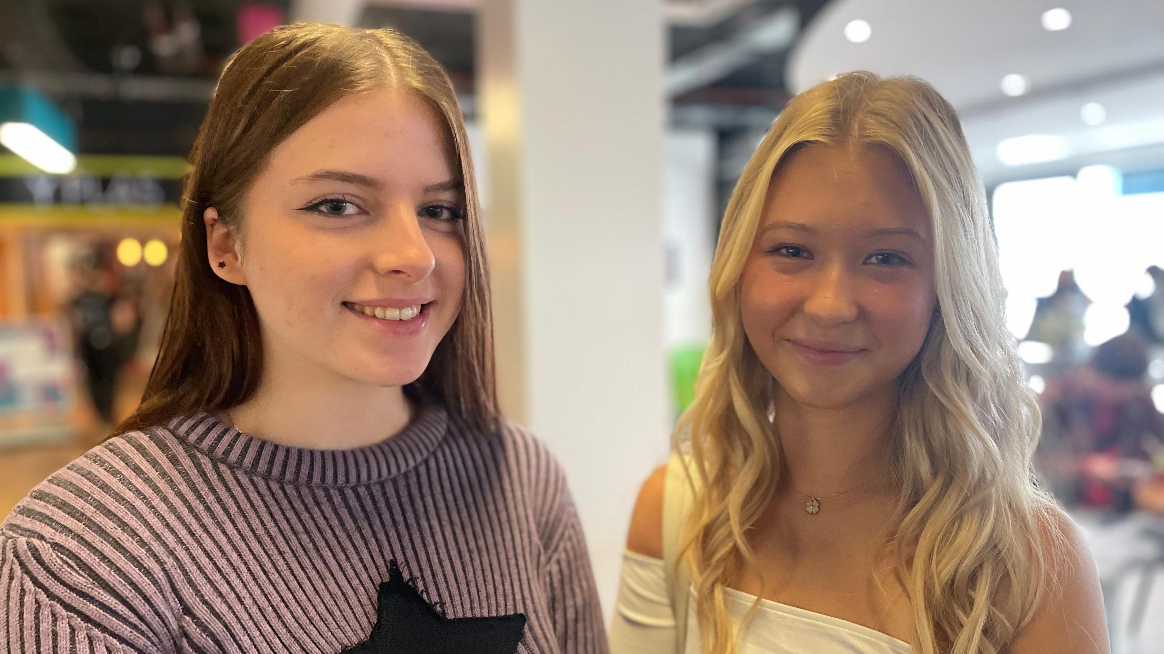 Two young women smiling at the camera