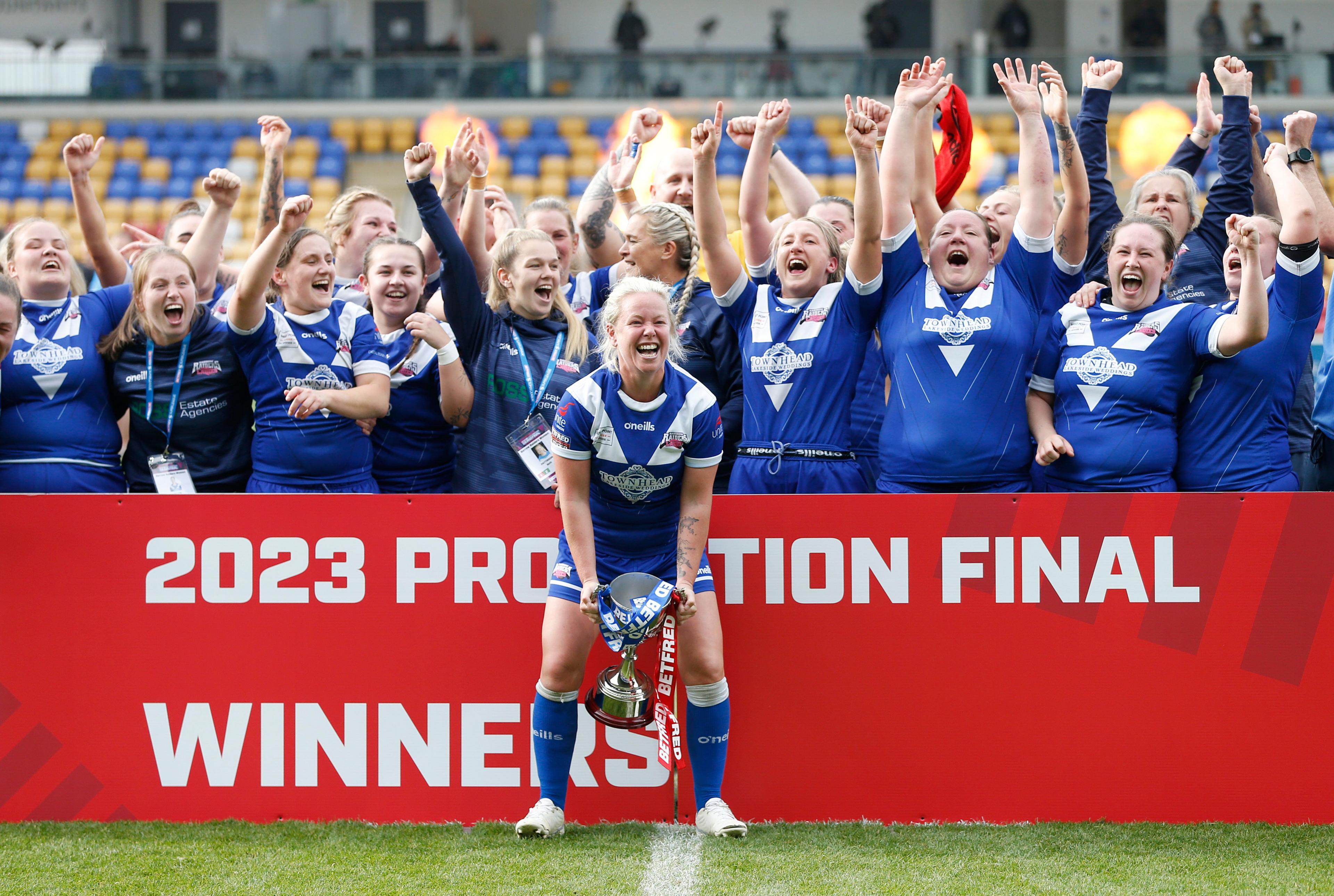 Barrow lift the trophy for the 2023 promotion final to the Women's Super League  