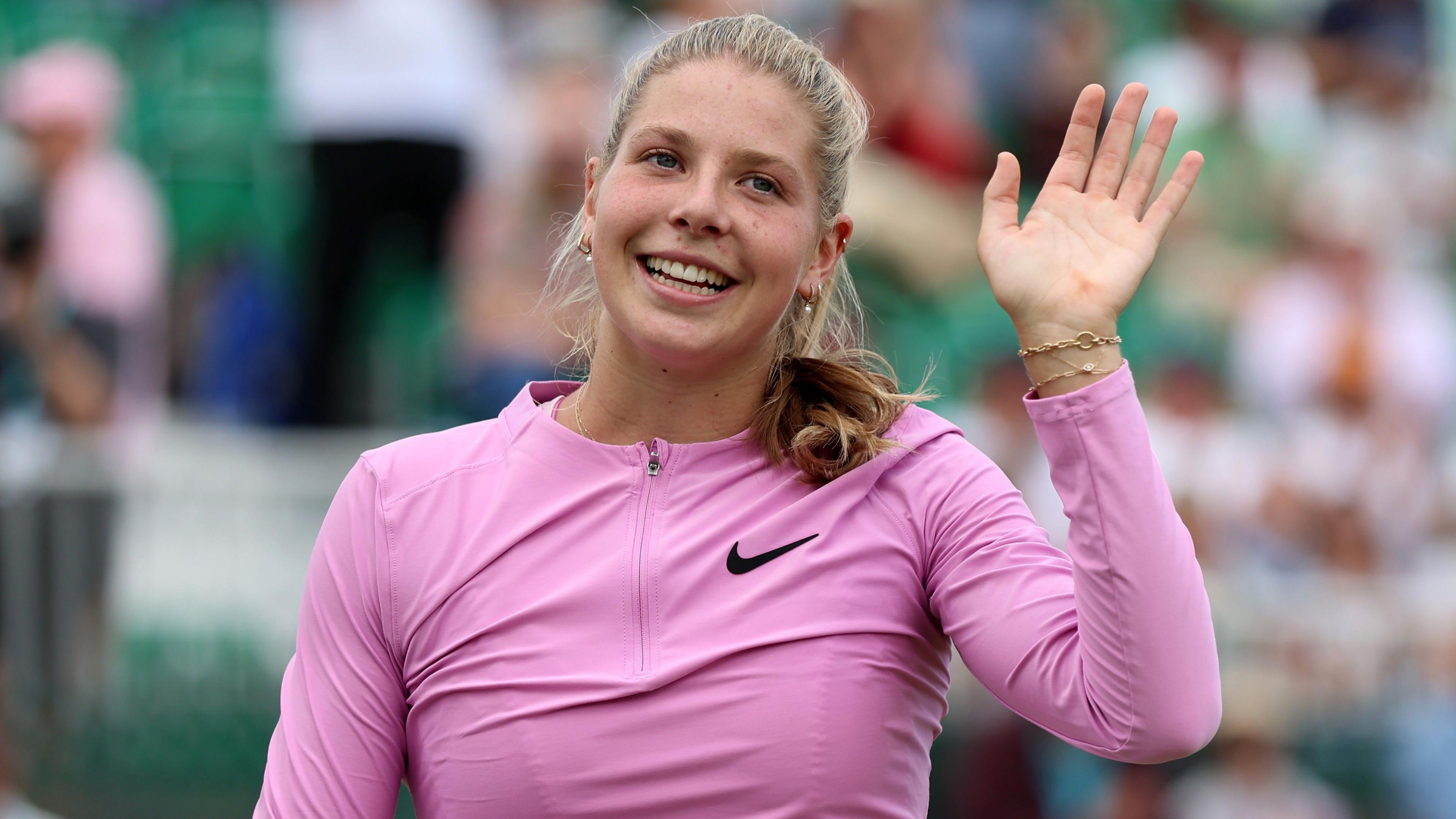 Hannah Klugman waves to the crowd after beating Harriet Dart at the Nottingham Open