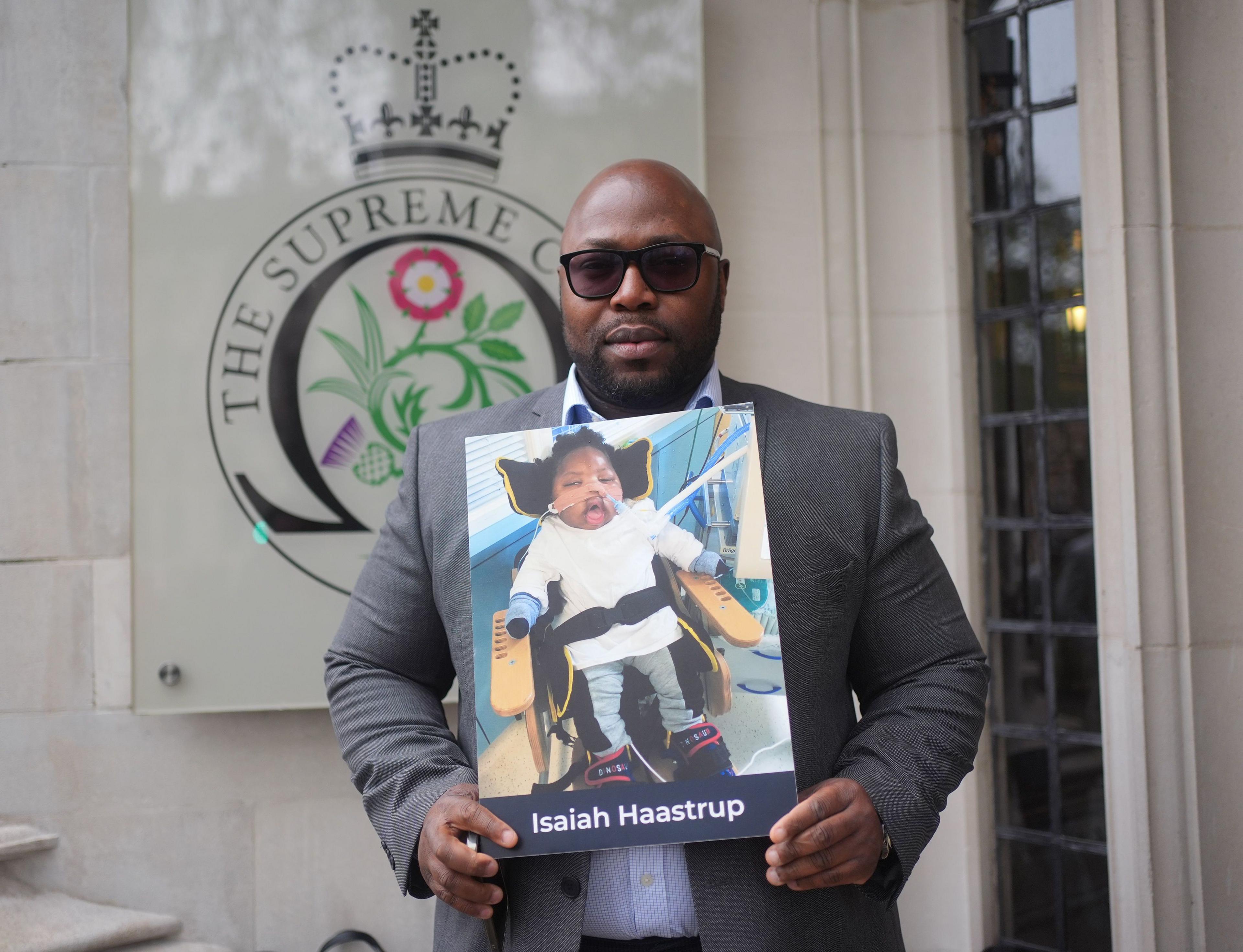 Lanre Haastrup, father of Isaiah Haastrup, outside the Supreme Court in London