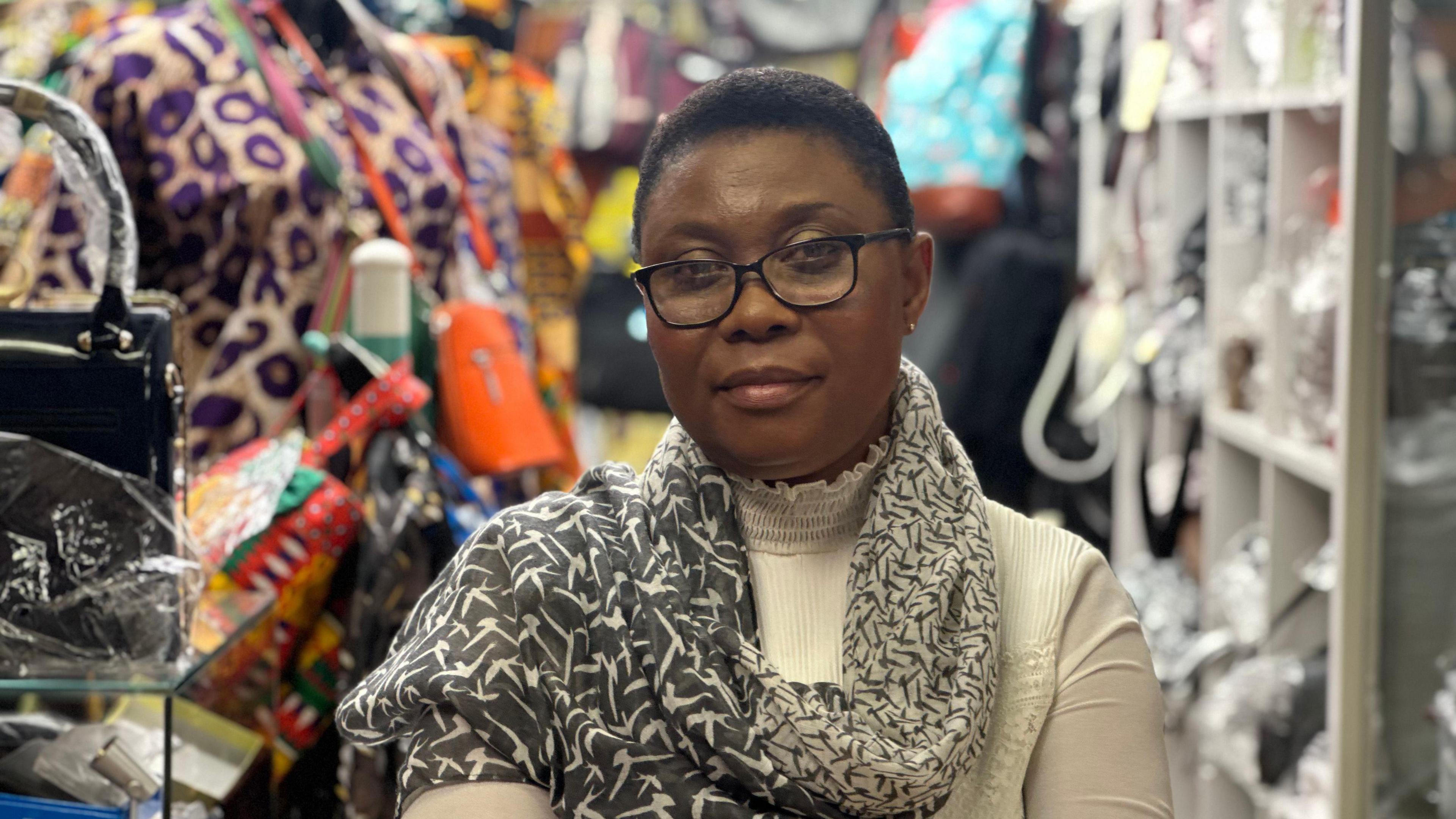 A trader pictured at her shop in Victoria shopping centre in Nottingham.