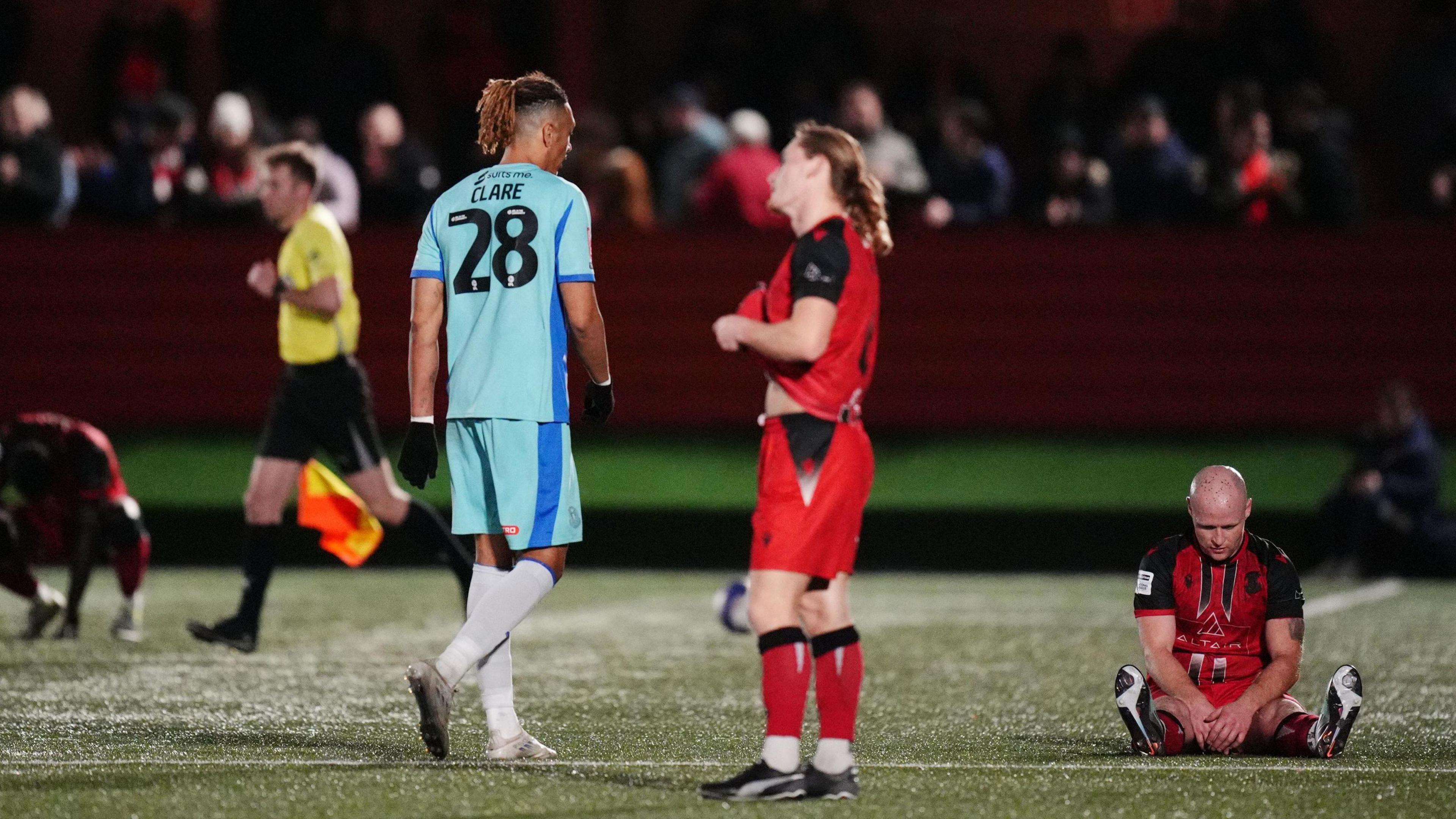 Tamworth players look dejected at full-time
