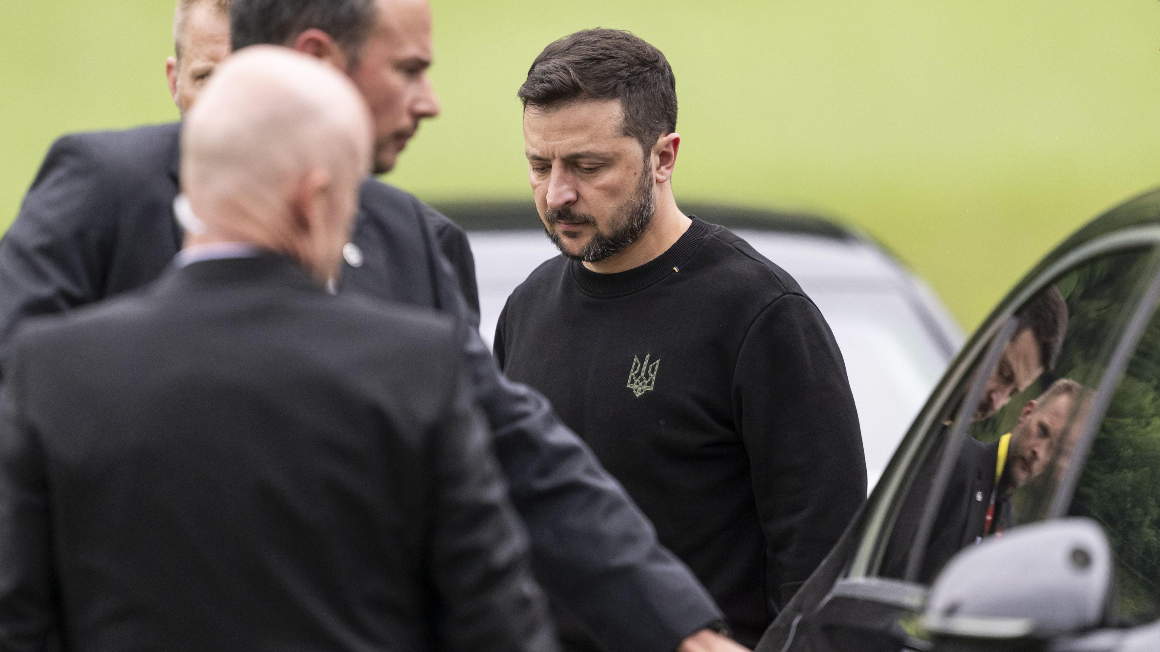 Ukraine's President Volodymyr Zelensky steps toward a limousine after landing in Obbuergen near the Buergenstock Resort, ahead the Summit on Peace in Ukraine, in Stansstad near Lucerne, Switzerland,