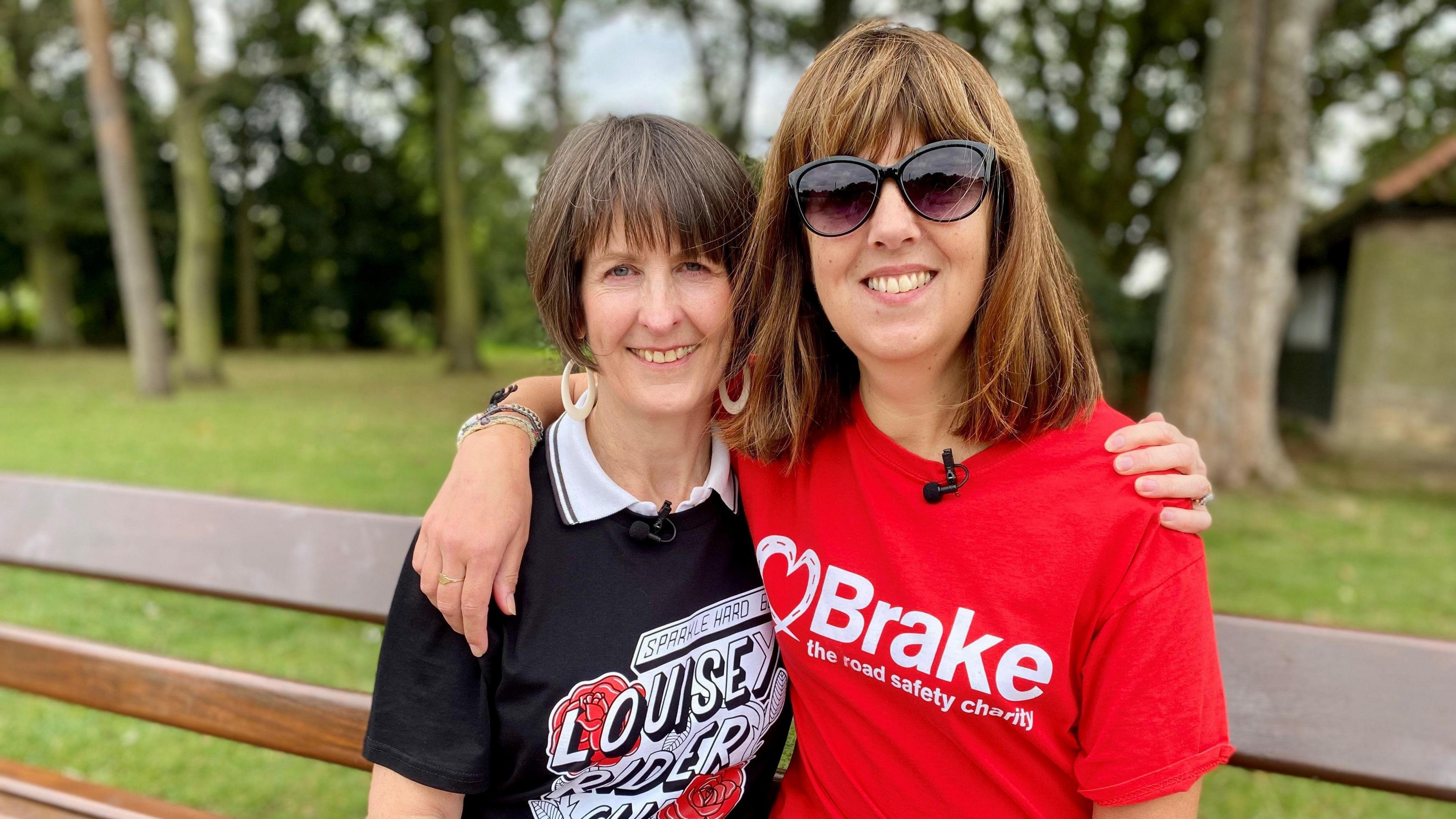 Ms Wright's mum Sharon Brown, sitting on a bench embracing friend Coleen Coxon