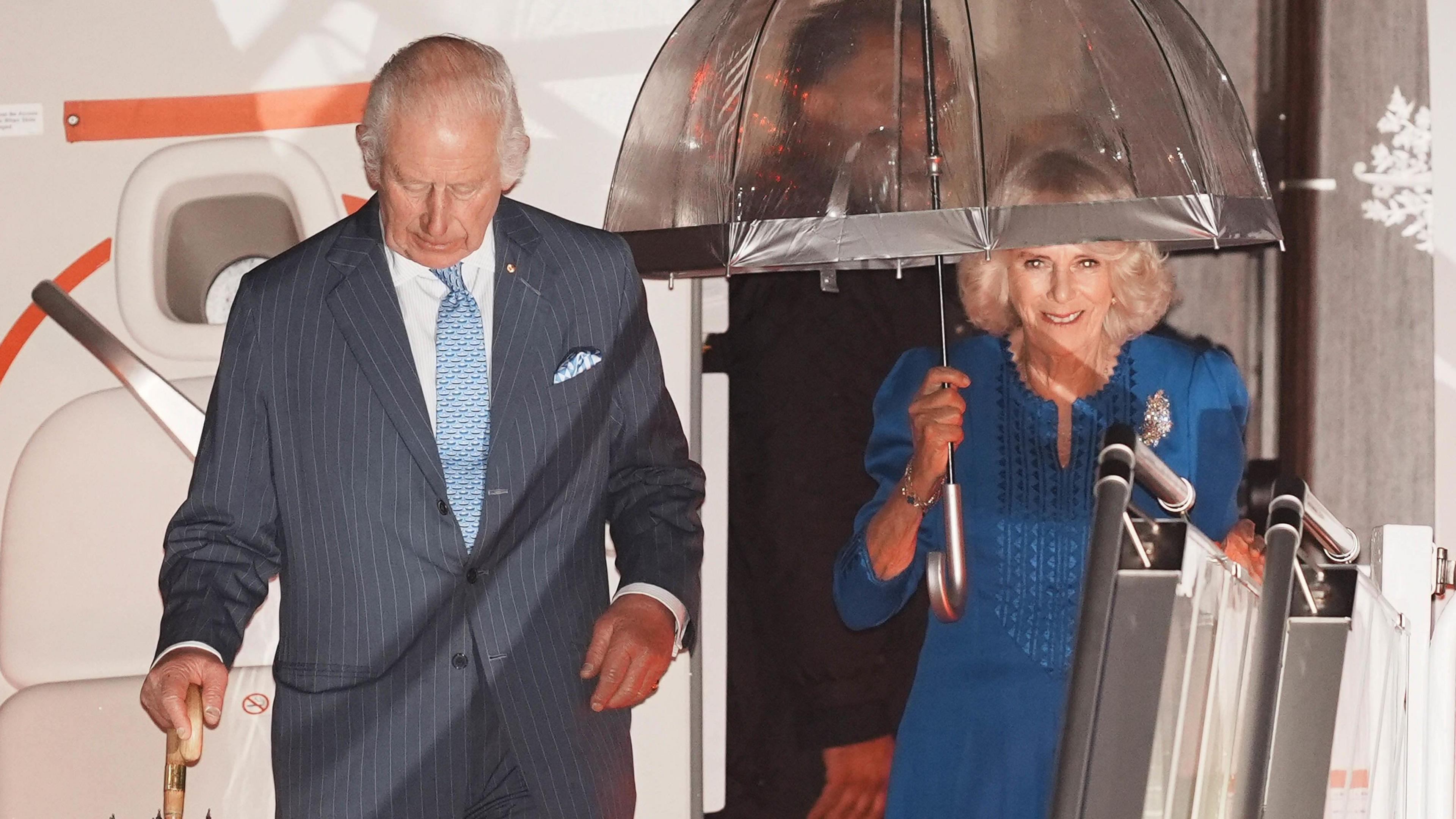 The King and Queen landing and coming down steps of their aircraft in Sydney, Australia