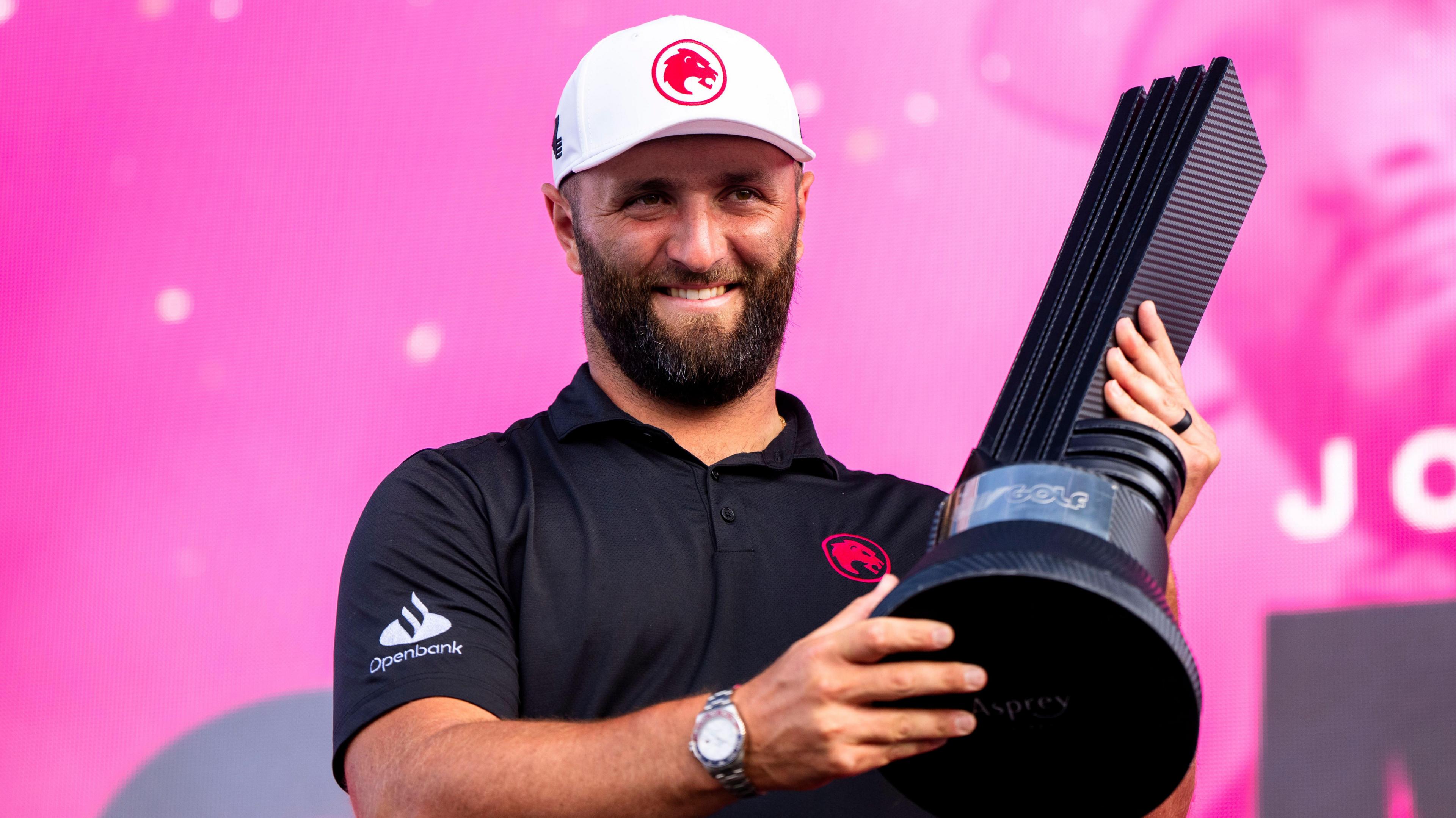 Jon Rahm celebrates winning the LIV Golf event in Chicago