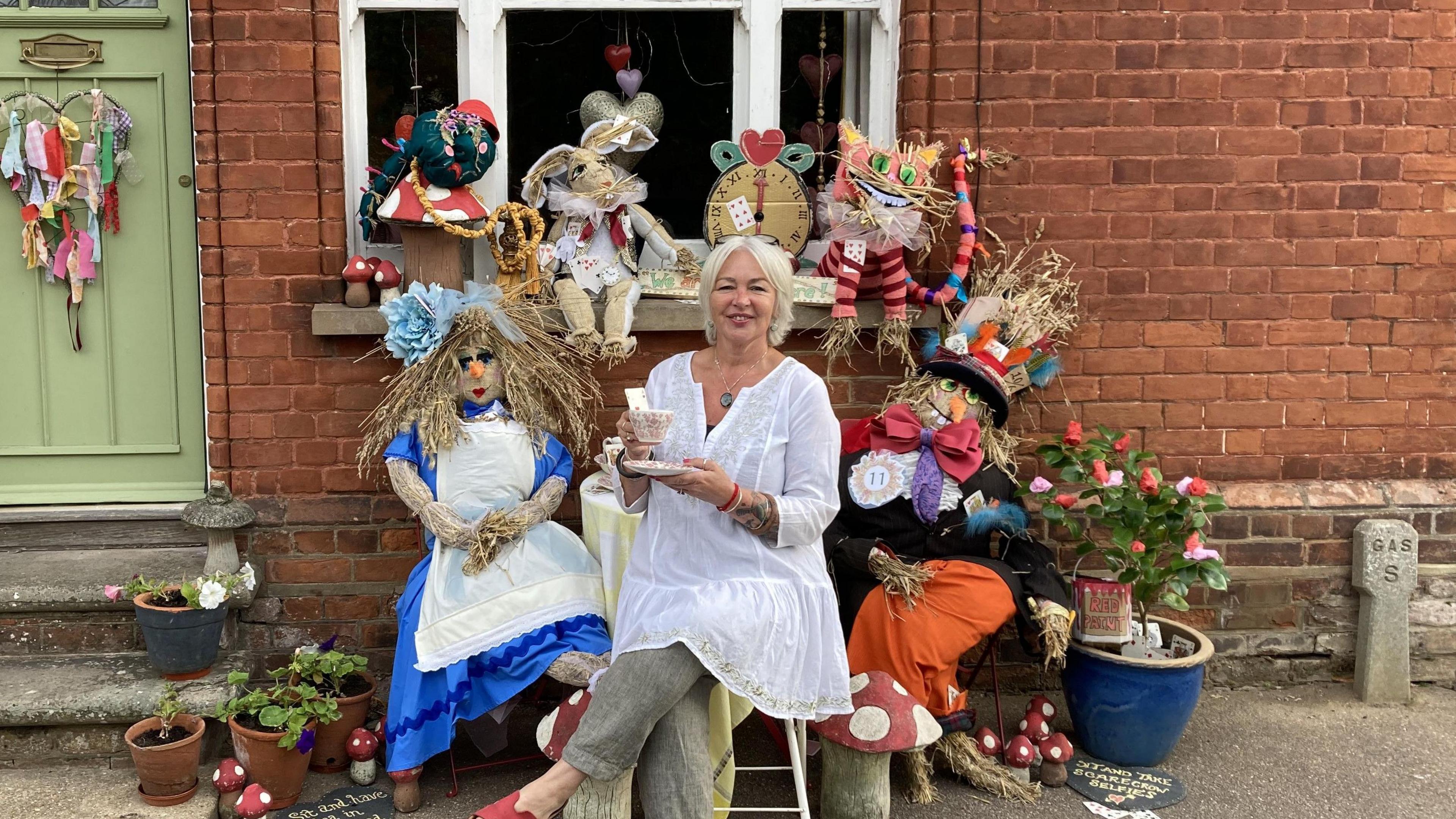 A wider view of Jo Byford's Alice in Wonderland scarecrow display