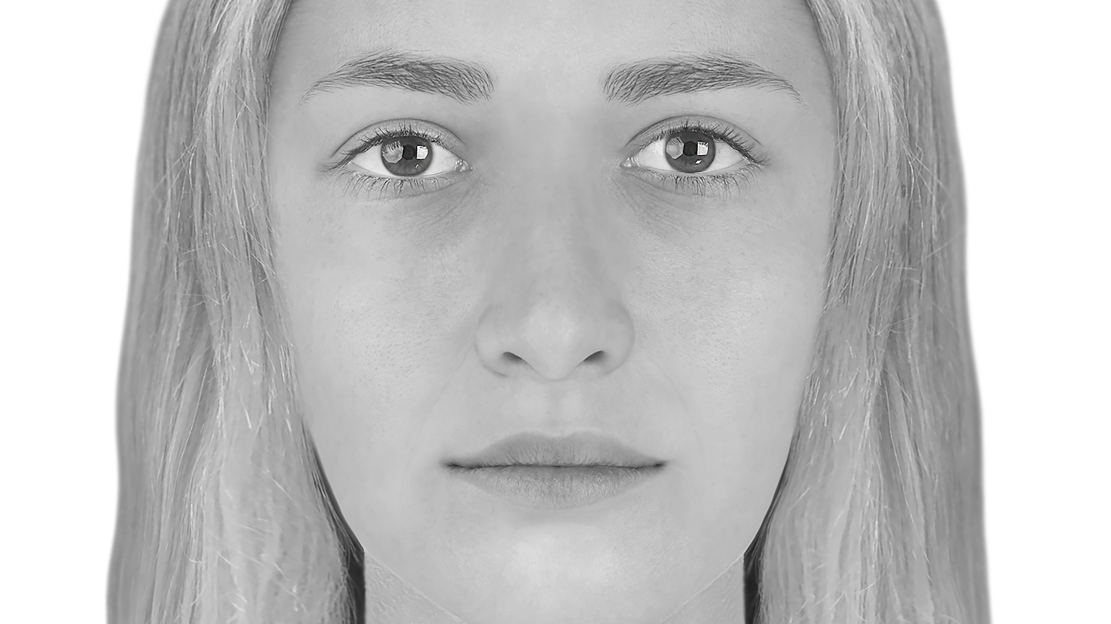 An E-fit of the face of a woman with light brown hair and hazel eyes 