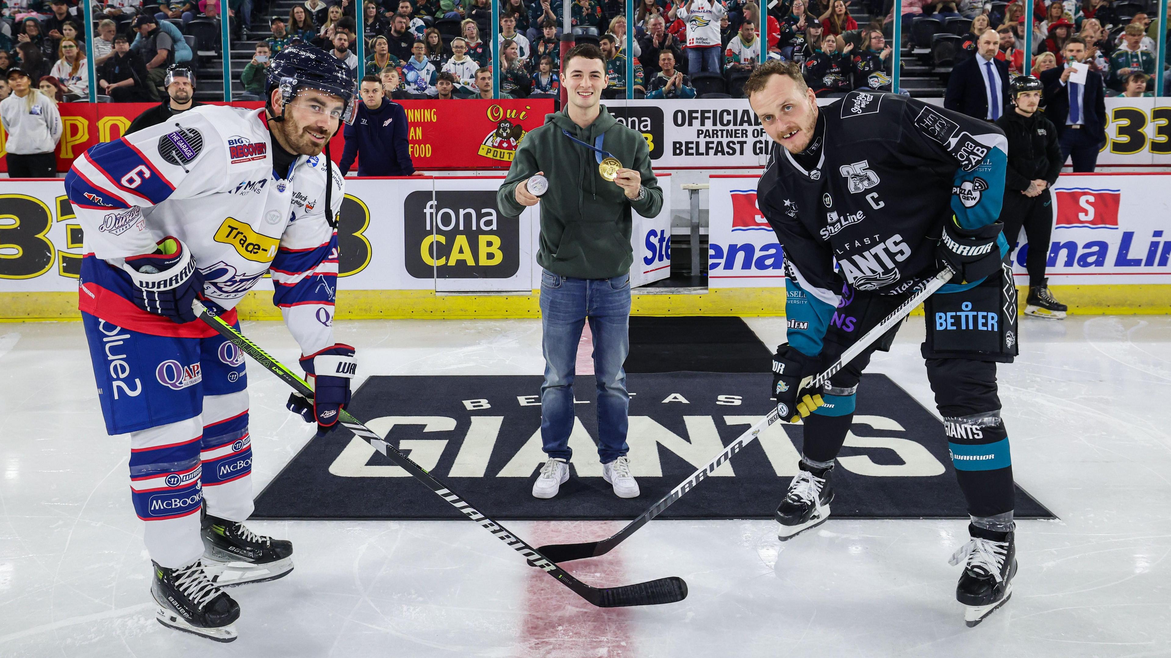 Olympic pommel horse champion Rhys McClenaghan dropped the ceremonial puck