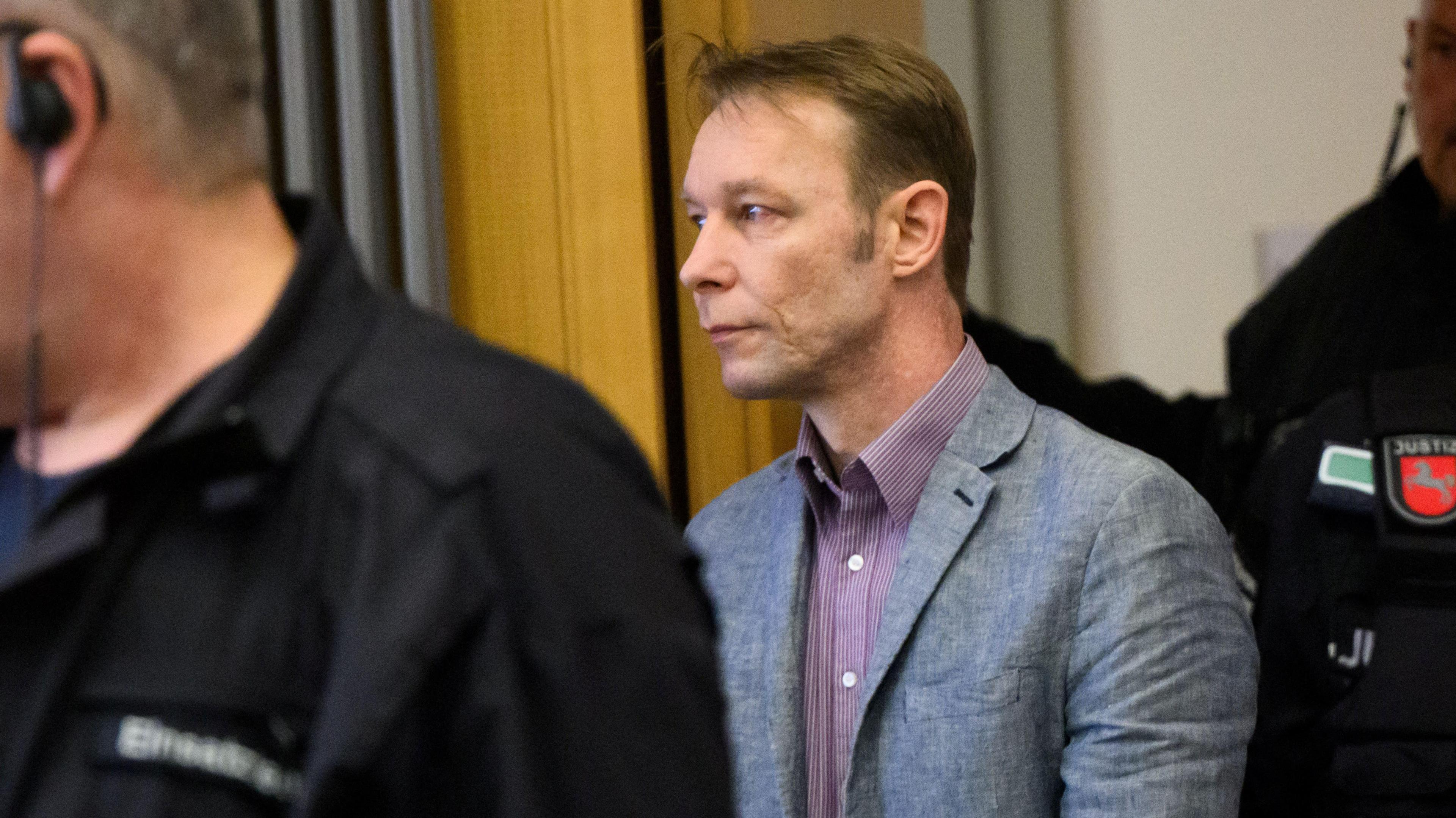 Christian Brückner, a man in a grey suit, in court