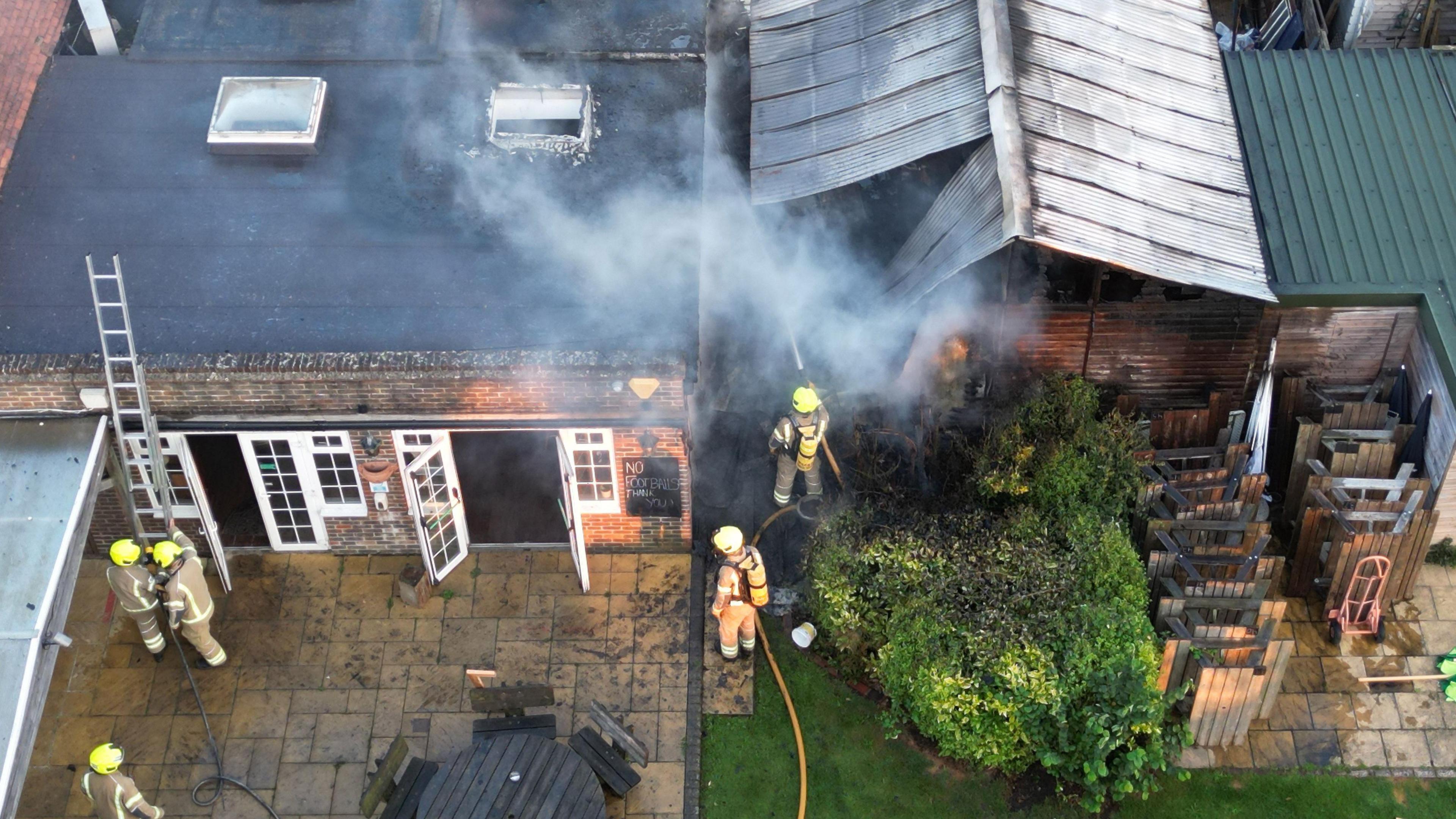 Firefighters tackling the fire