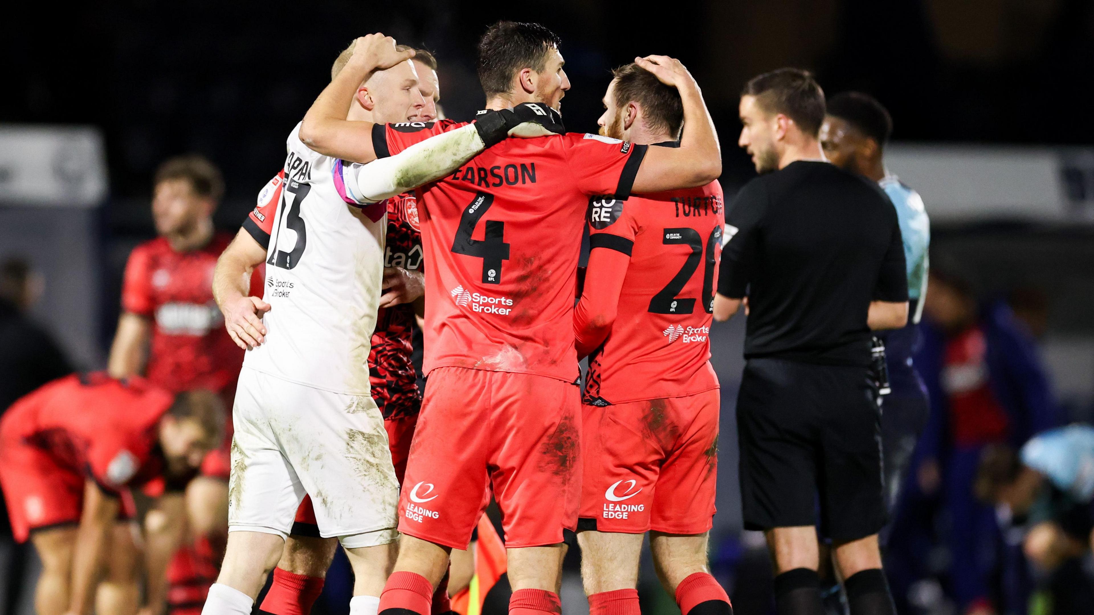 Huddersfield players celebrate their victory at Wycombe