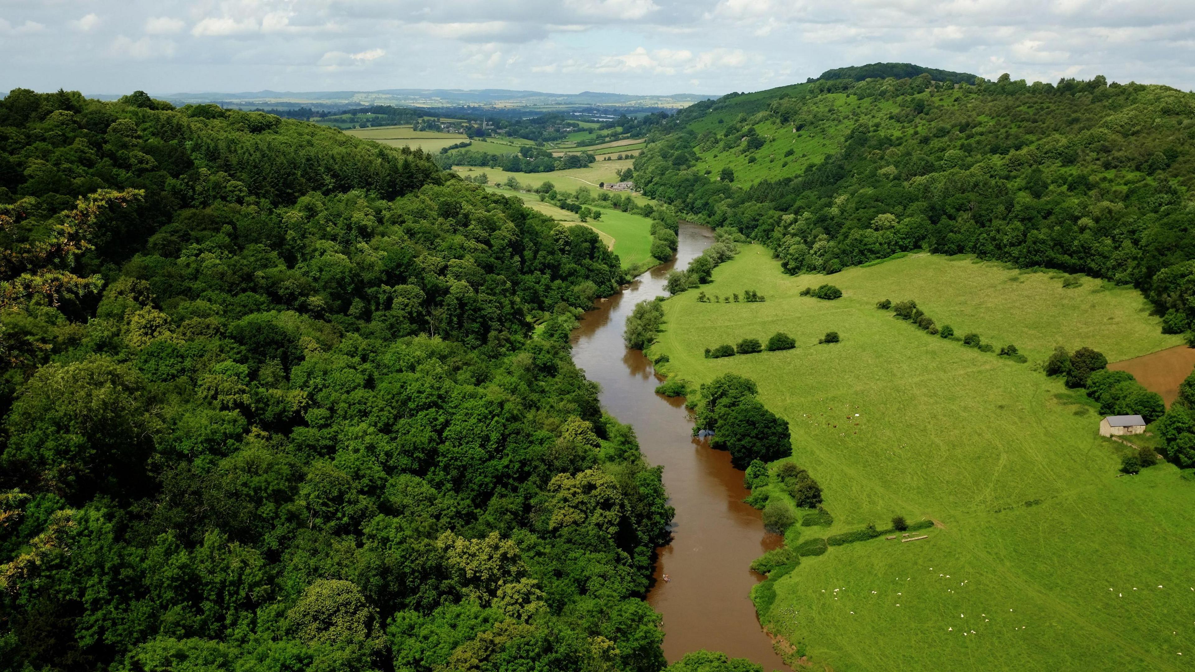 The River Wye, seen from Symonds Yat Rock in Symonds Yat, Herefordshire, near the border with Gloucestershire and Monmouthshire, Wales. On the left is Huntsham Hill, and Coppet Hill is on the right, with the village of Goodrich just visible in the background.