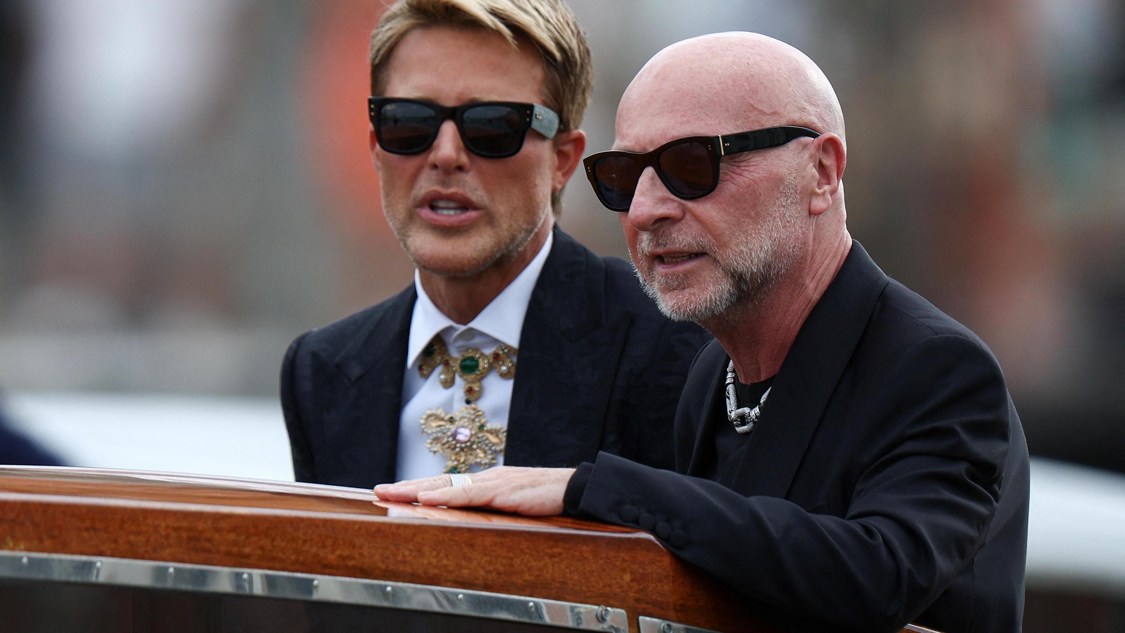 Fashion designer Domenico Dolce dressed in a black suit, black sunglasses, and jewellery 