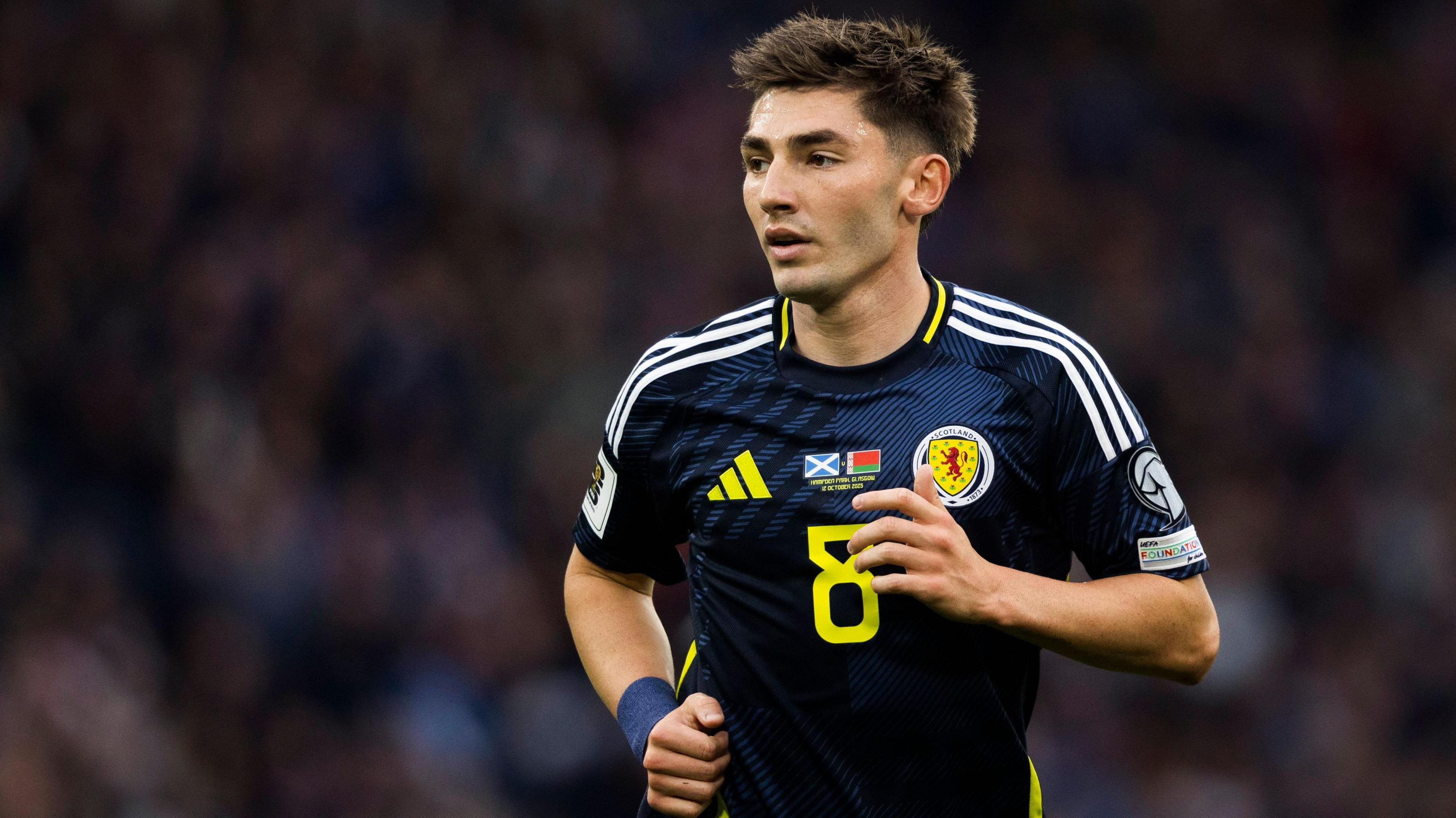 Billy Gilmour mid-stride while playing for Scotland against Belarus.